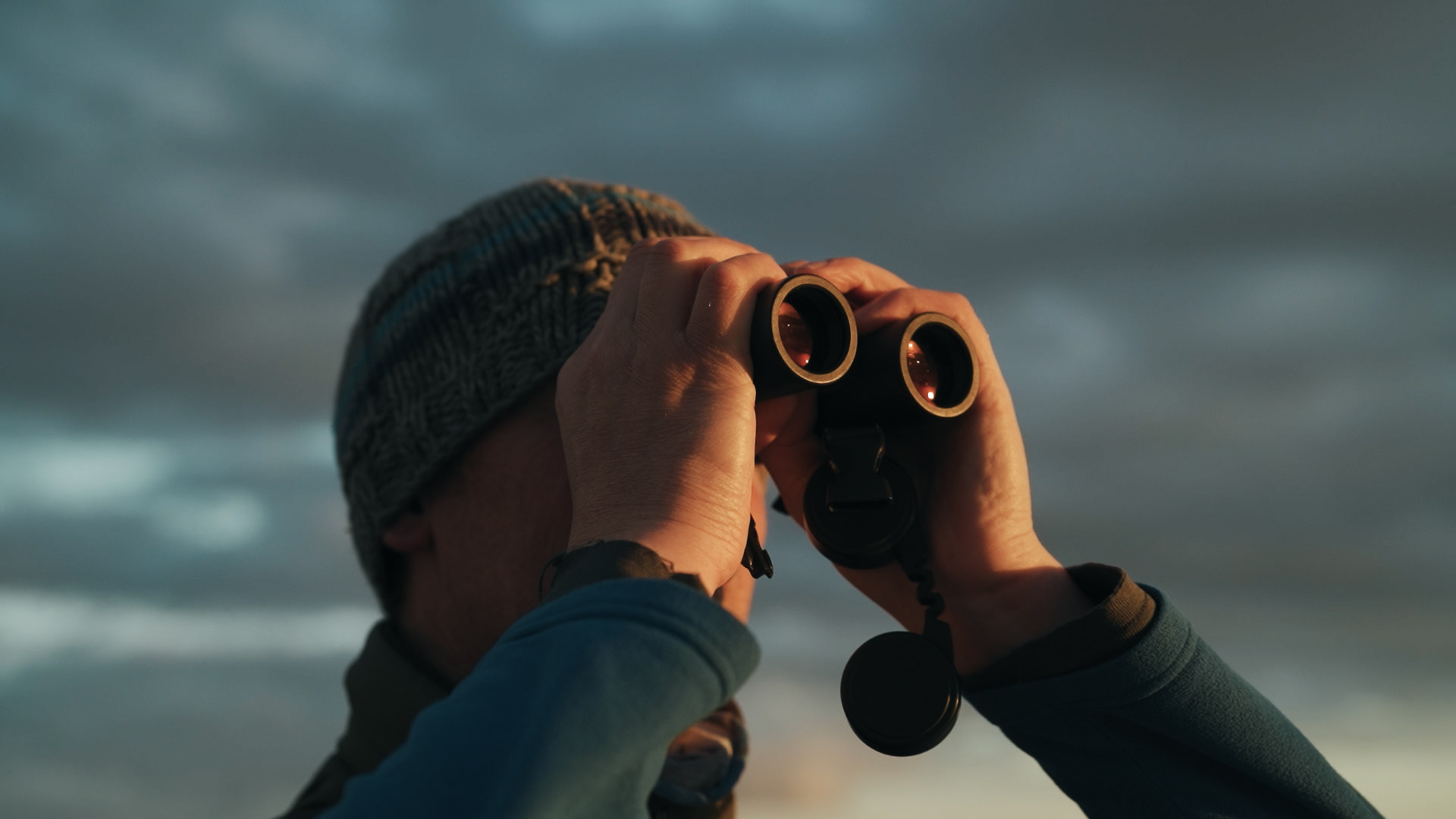 Steve Truluck looking through binoculars, a still image from the short film Truluck by Matt Cannon and Jake Smallwood