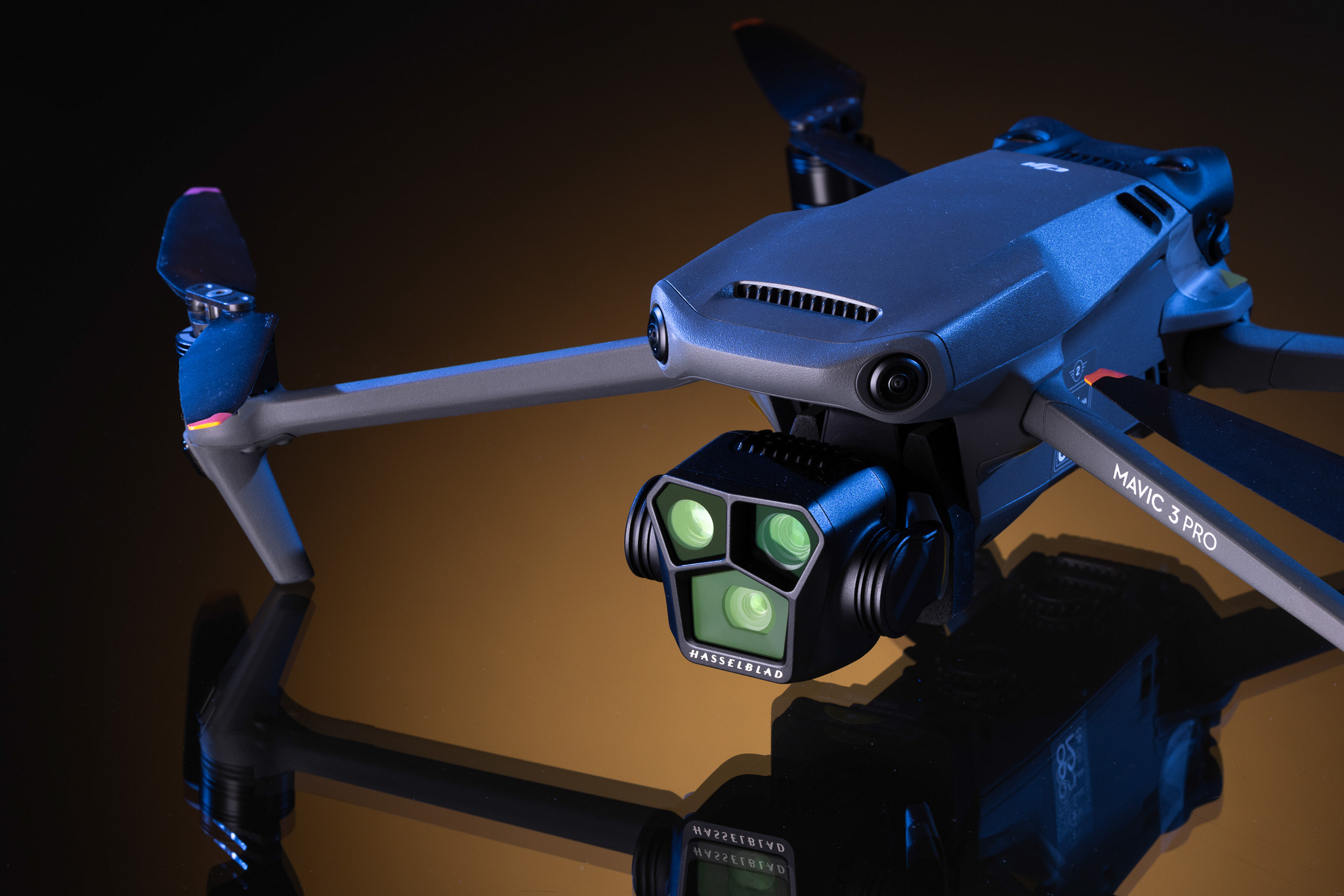 Close-up of the DJI Mavic 3 Pro drone featuring the triple-lens Hasselblad camera system and advanced obstacle sensors.
