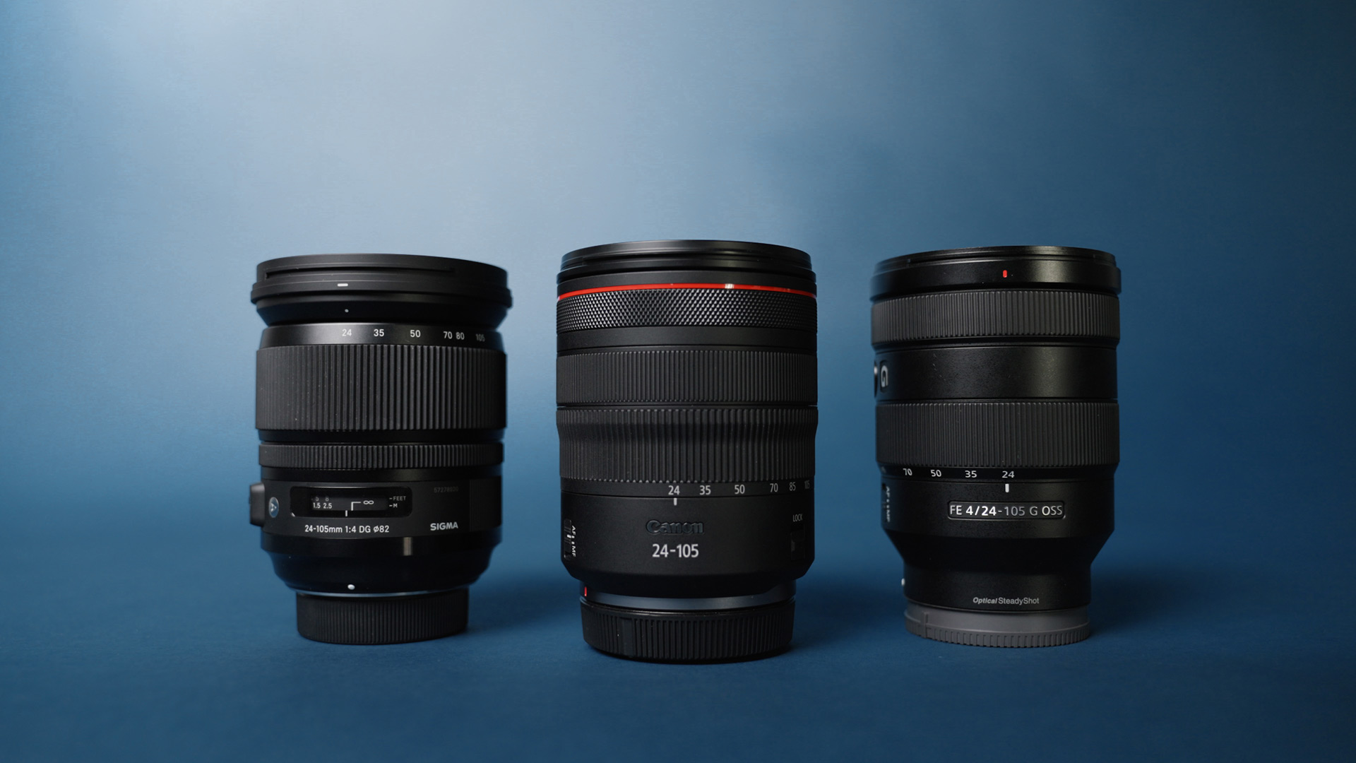Group of lenses on a black background with 24–105mm zoom lens at the center