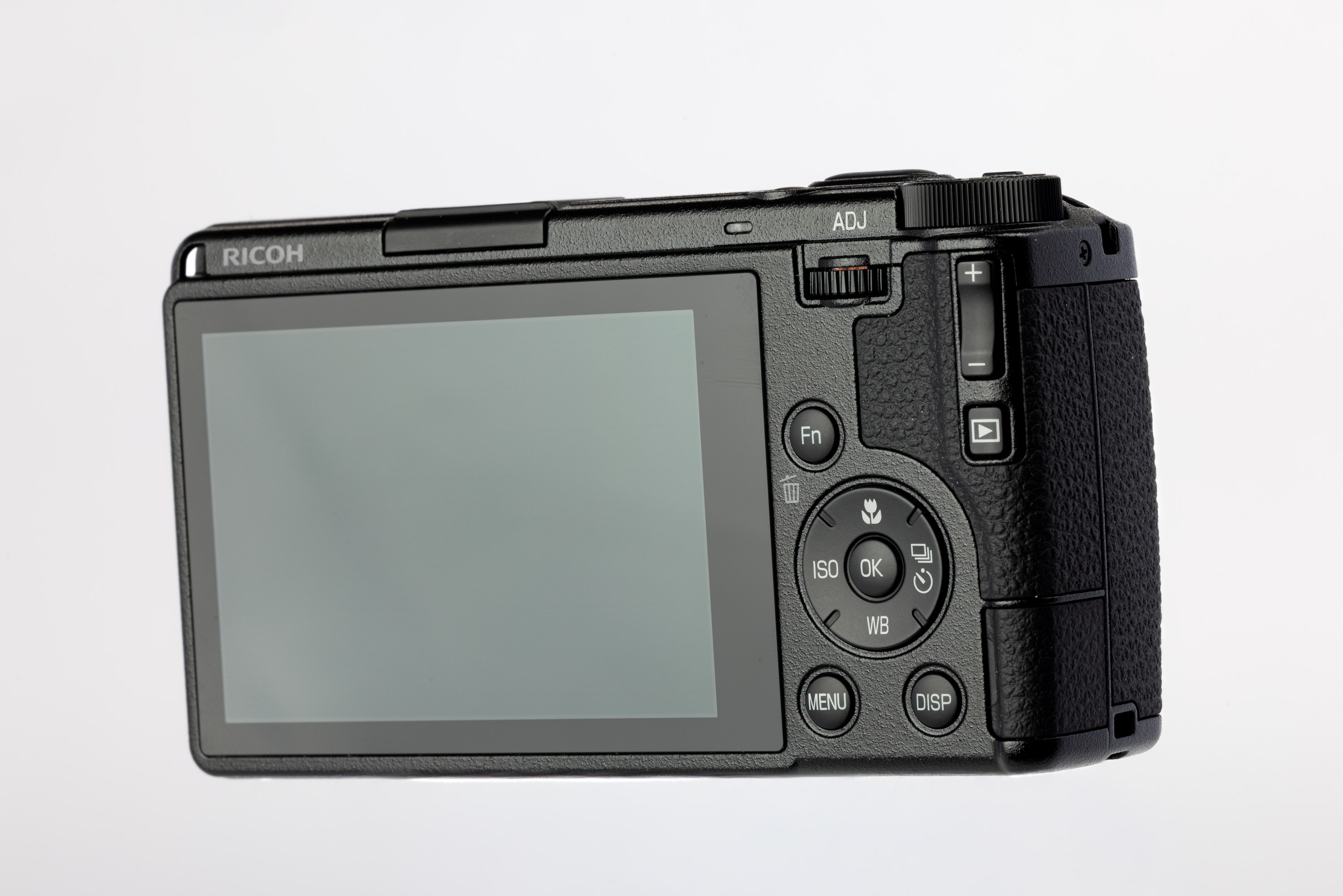 Rückseite einer gebrauchten Ricoh GR IV mit Wählrädern und festem Display