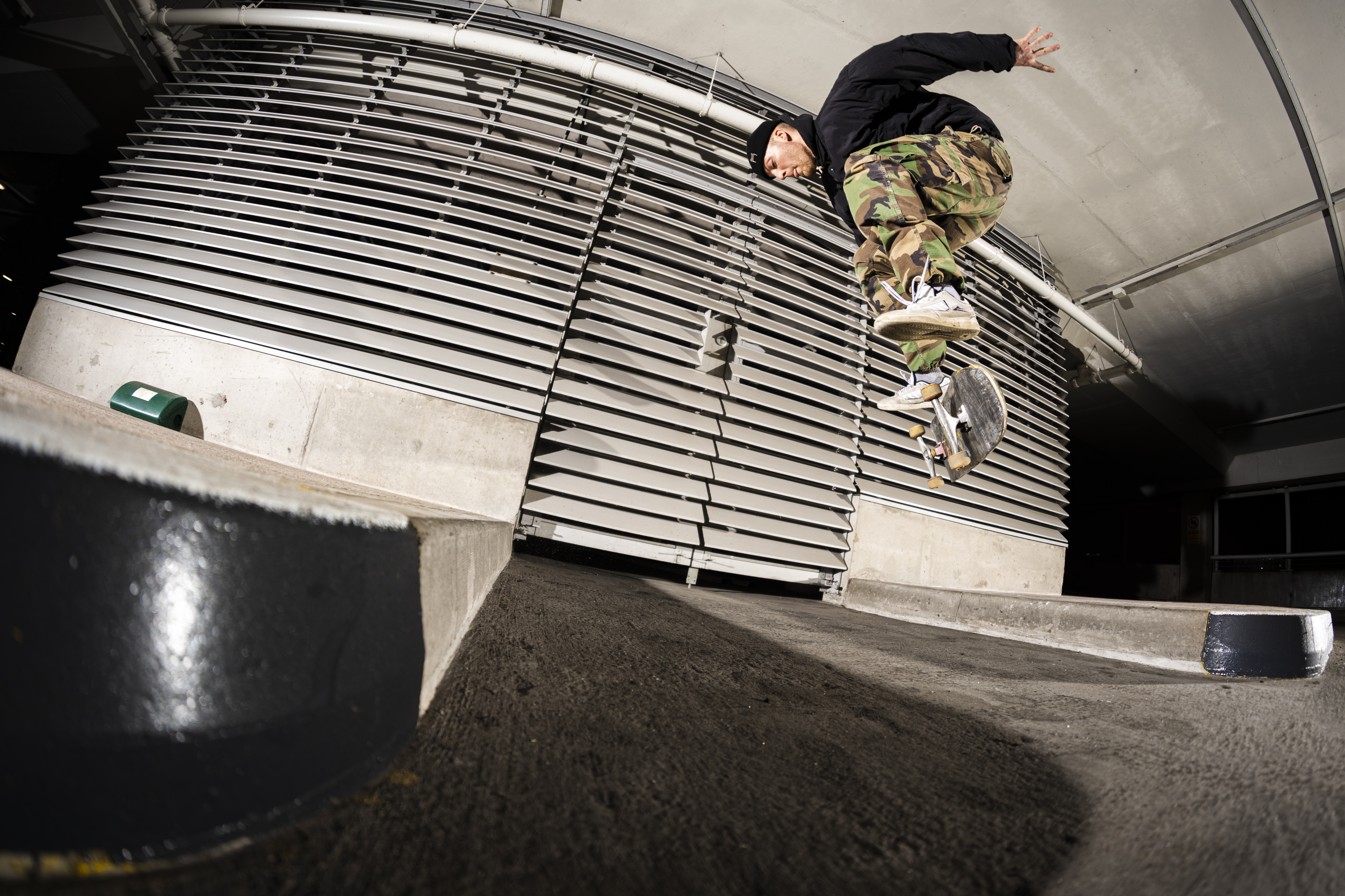 Photo of skateboarder Henry Fox jumping in mid air at a skate park by photographer Rob Whiston 