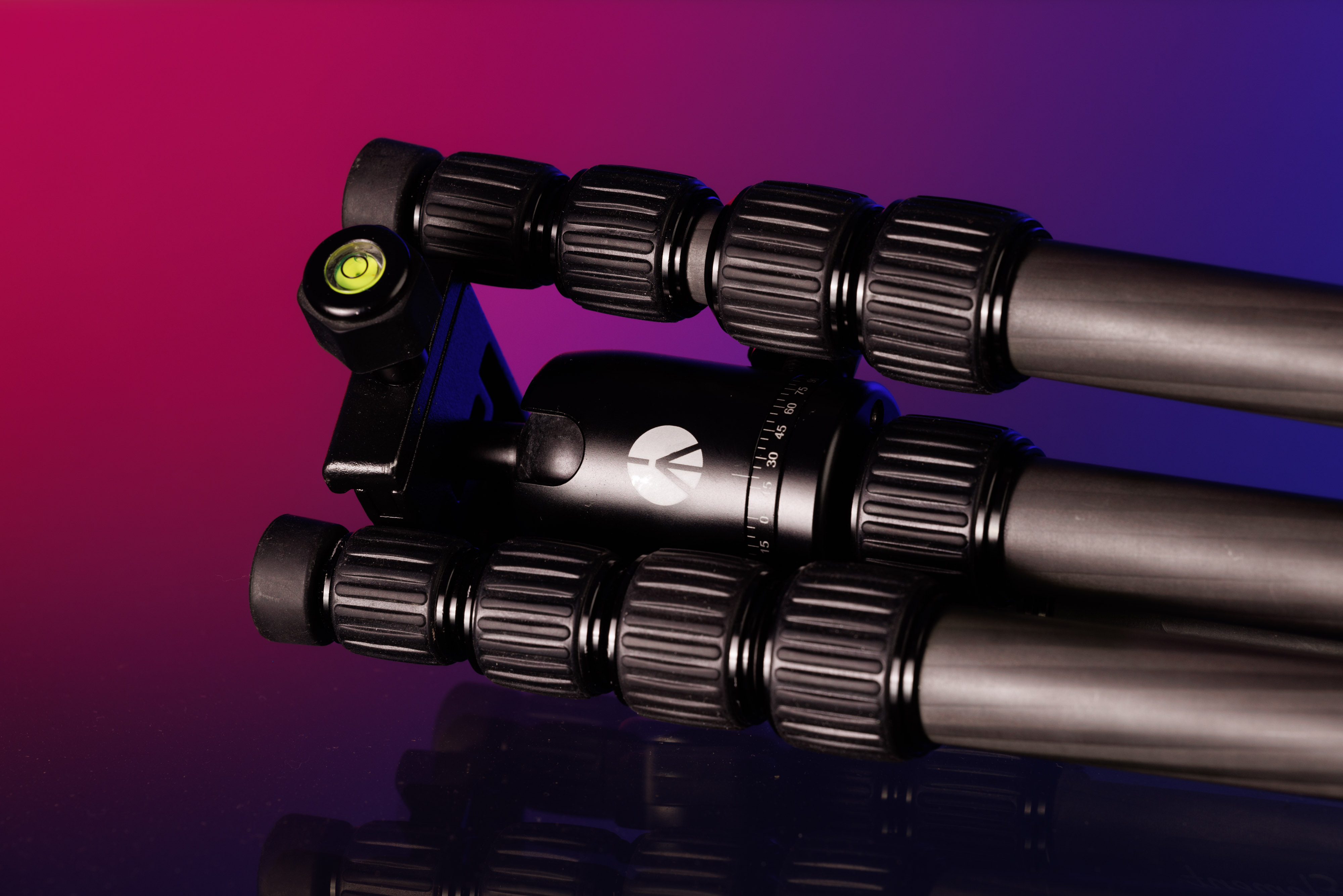 Used Manfrotto tripod on a blue and black background