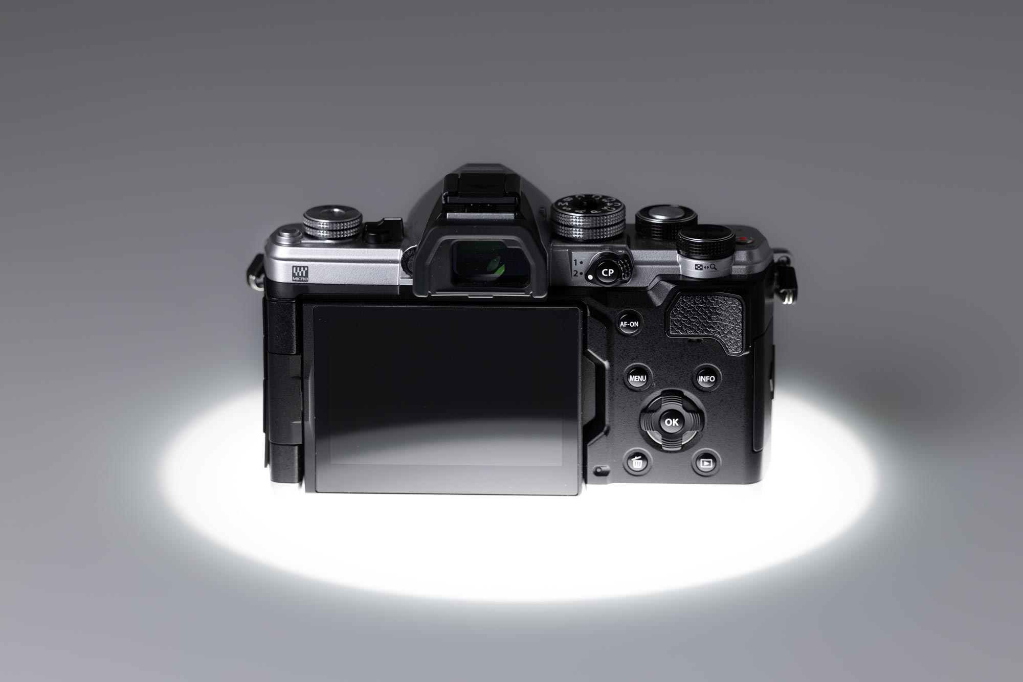 Back of a used OM System OM-3