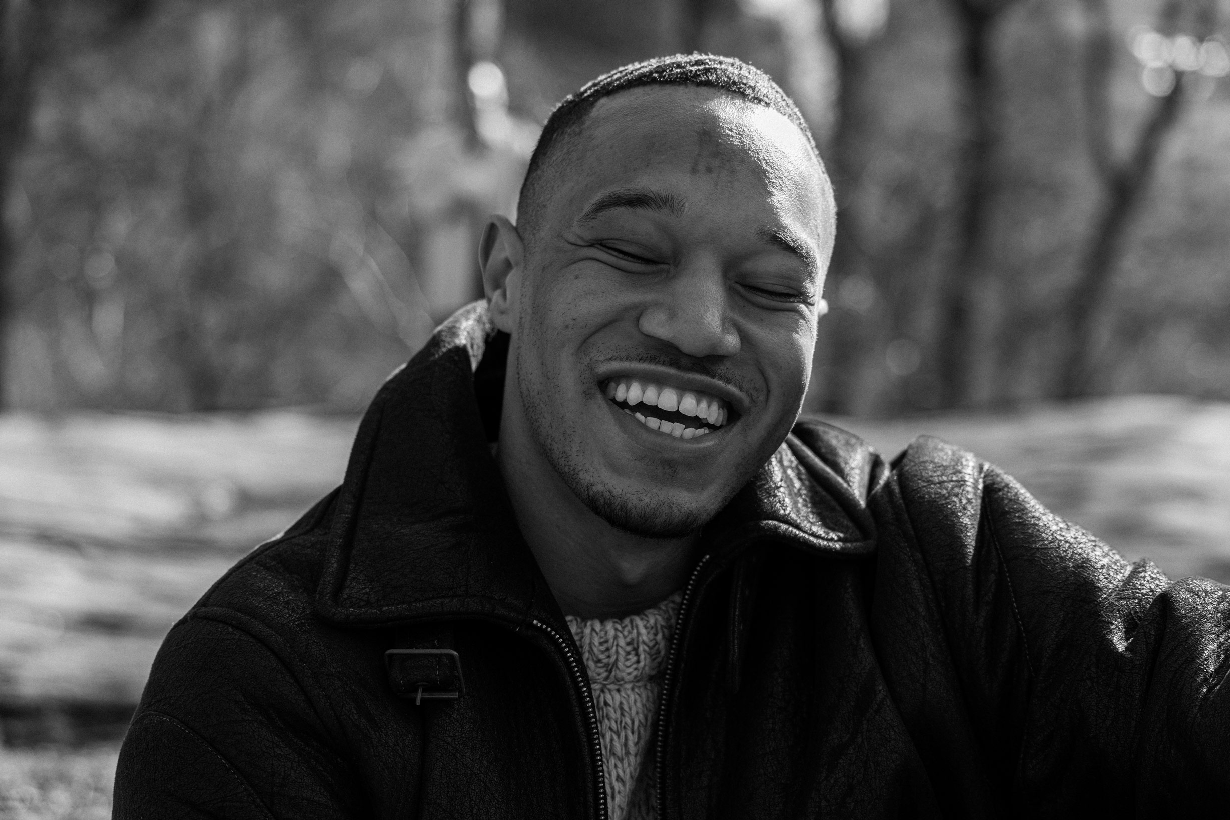 Black-and-white photo of person smiling in Central Park
