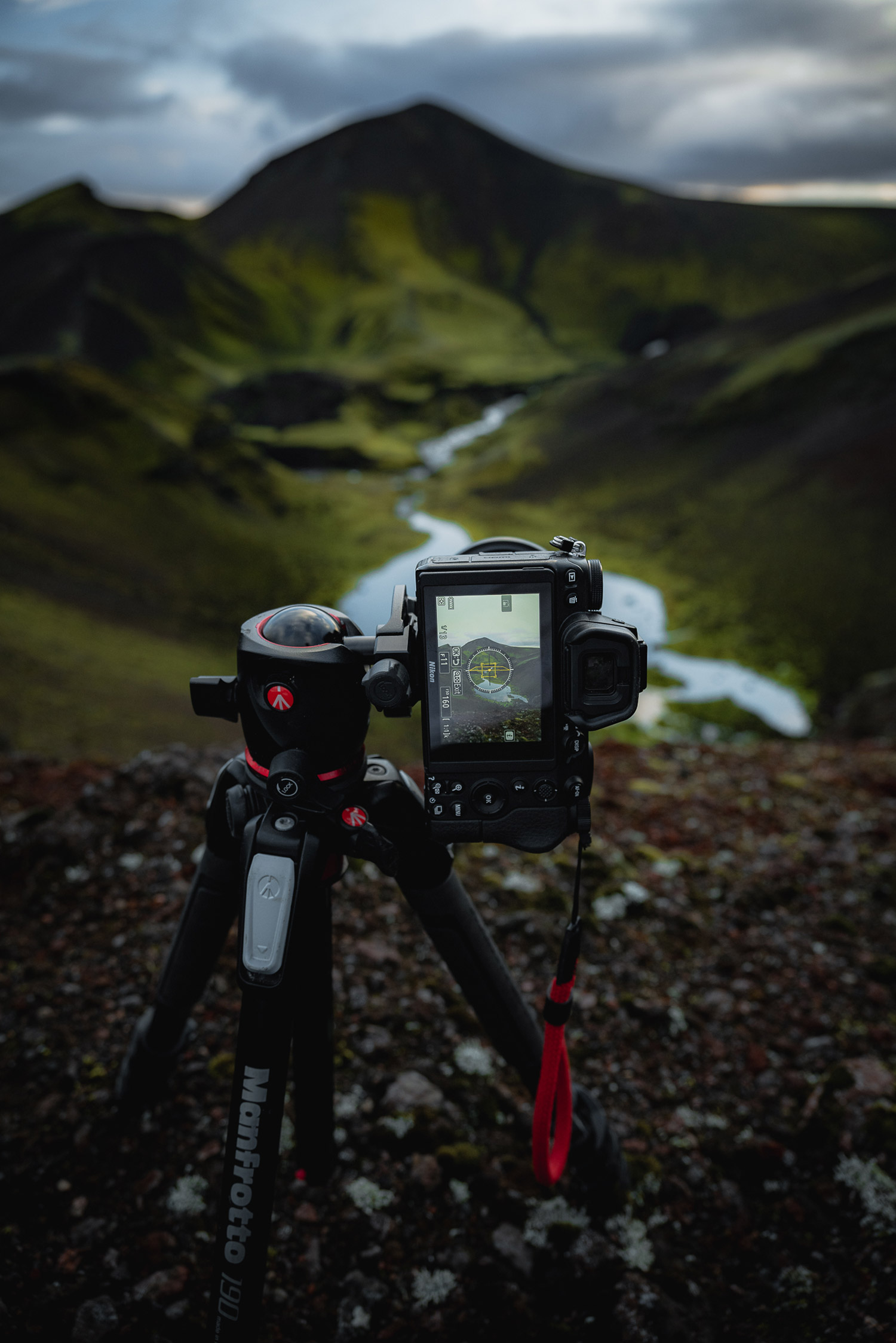 A photo of the Nikon Z6, mounted onto a Manfrotto tripod, taking a photo of a mountain landscape in Iceland, shot on a Panasonic S1R by Paul Watson