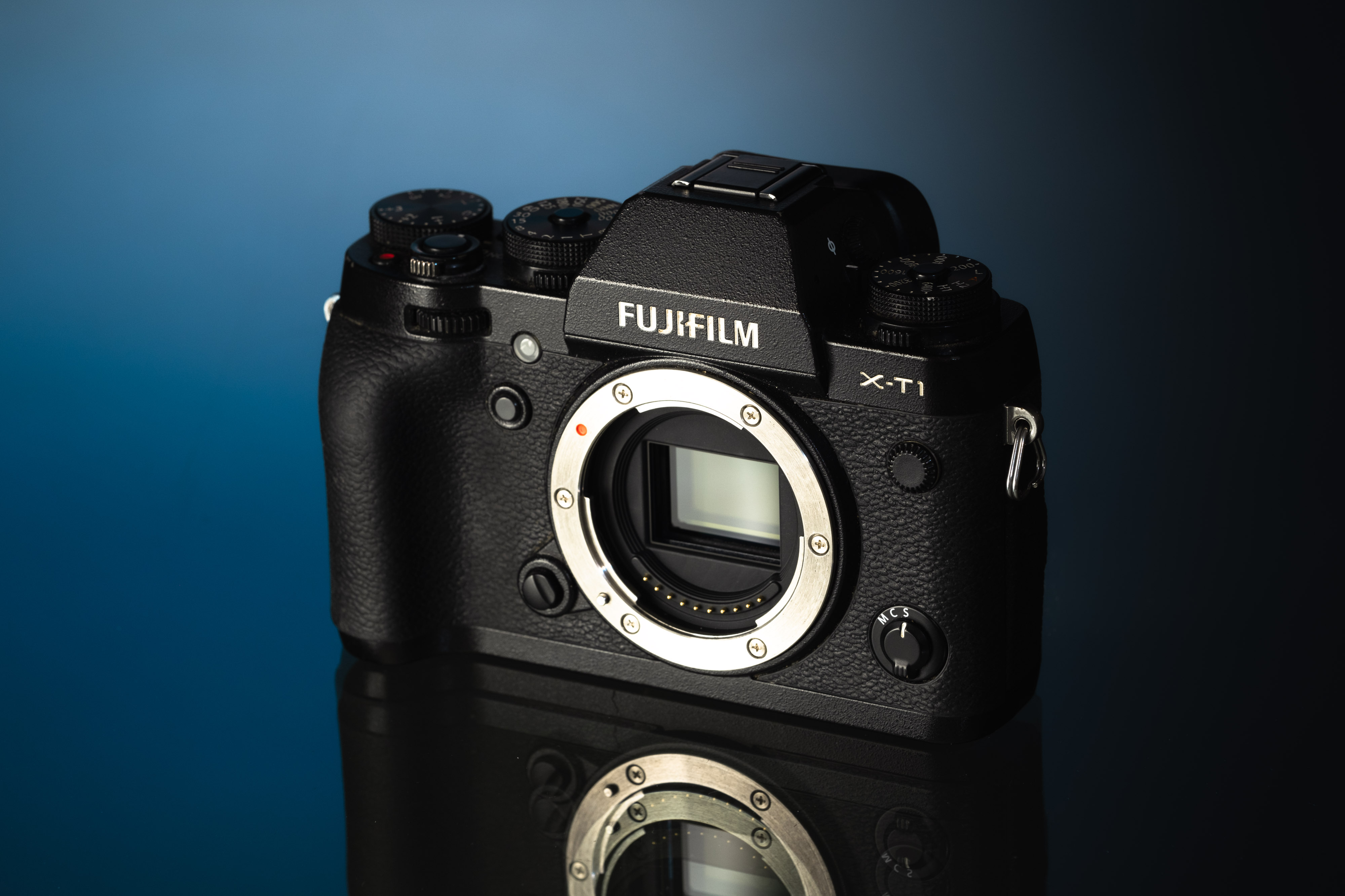 A Fujifilm X-T1, IR converted, on a blue and black background