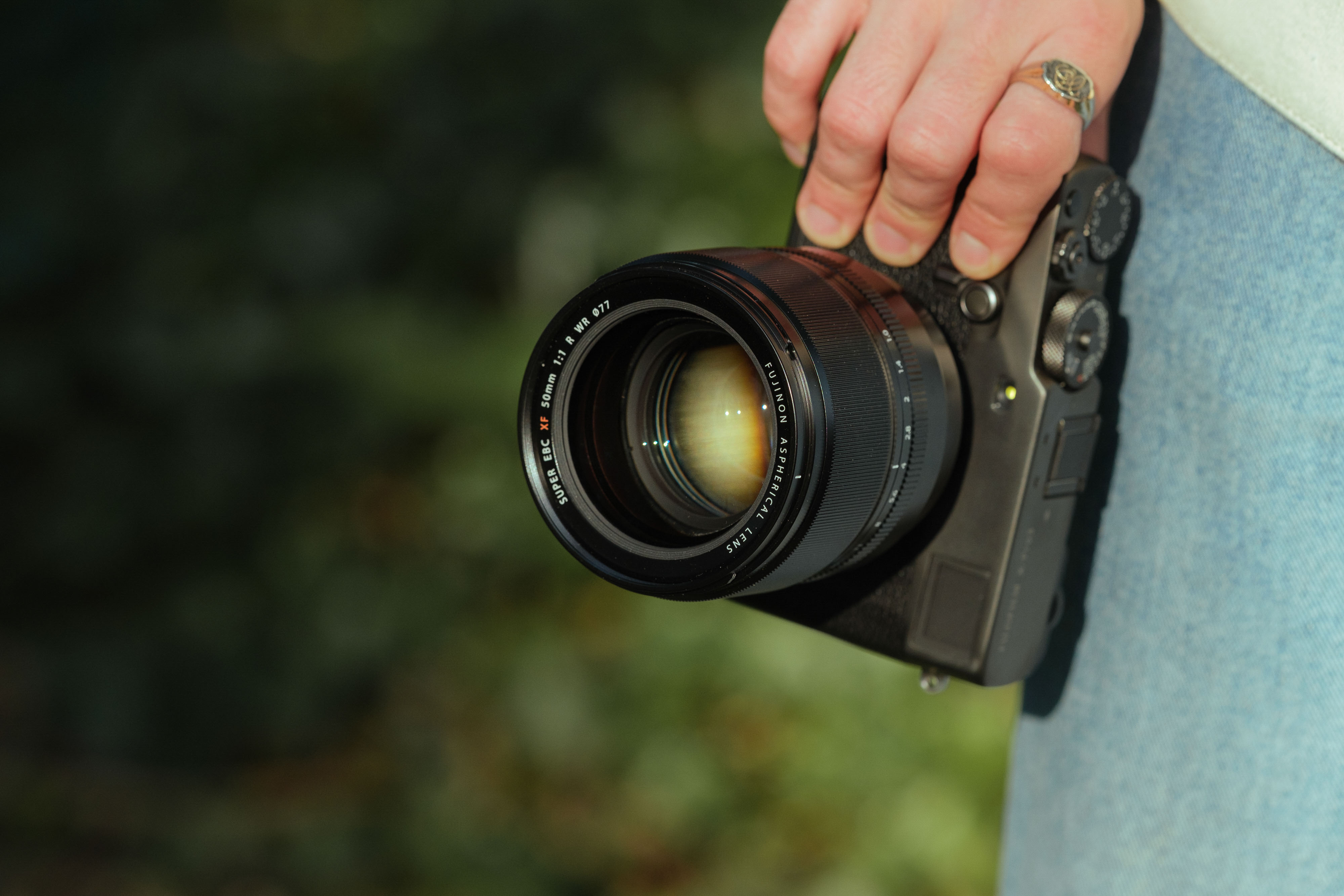 Fujifilm X-Pro 3 with a Fujifilm XF 50mm f/1.0 R WR attached being held in direct light