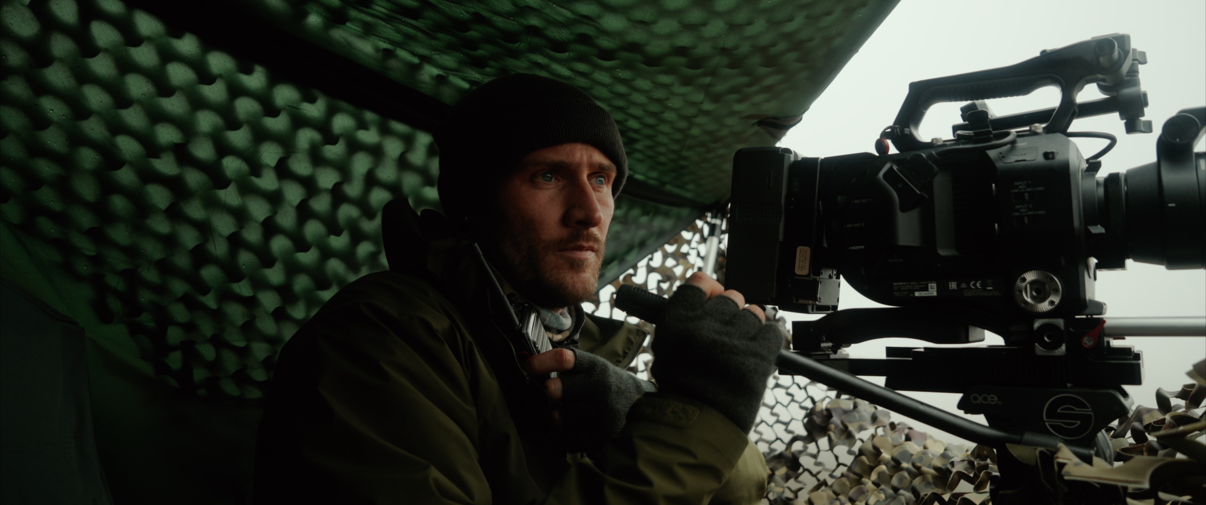 A person using a video camera to capture Eagles whilst in a hideout