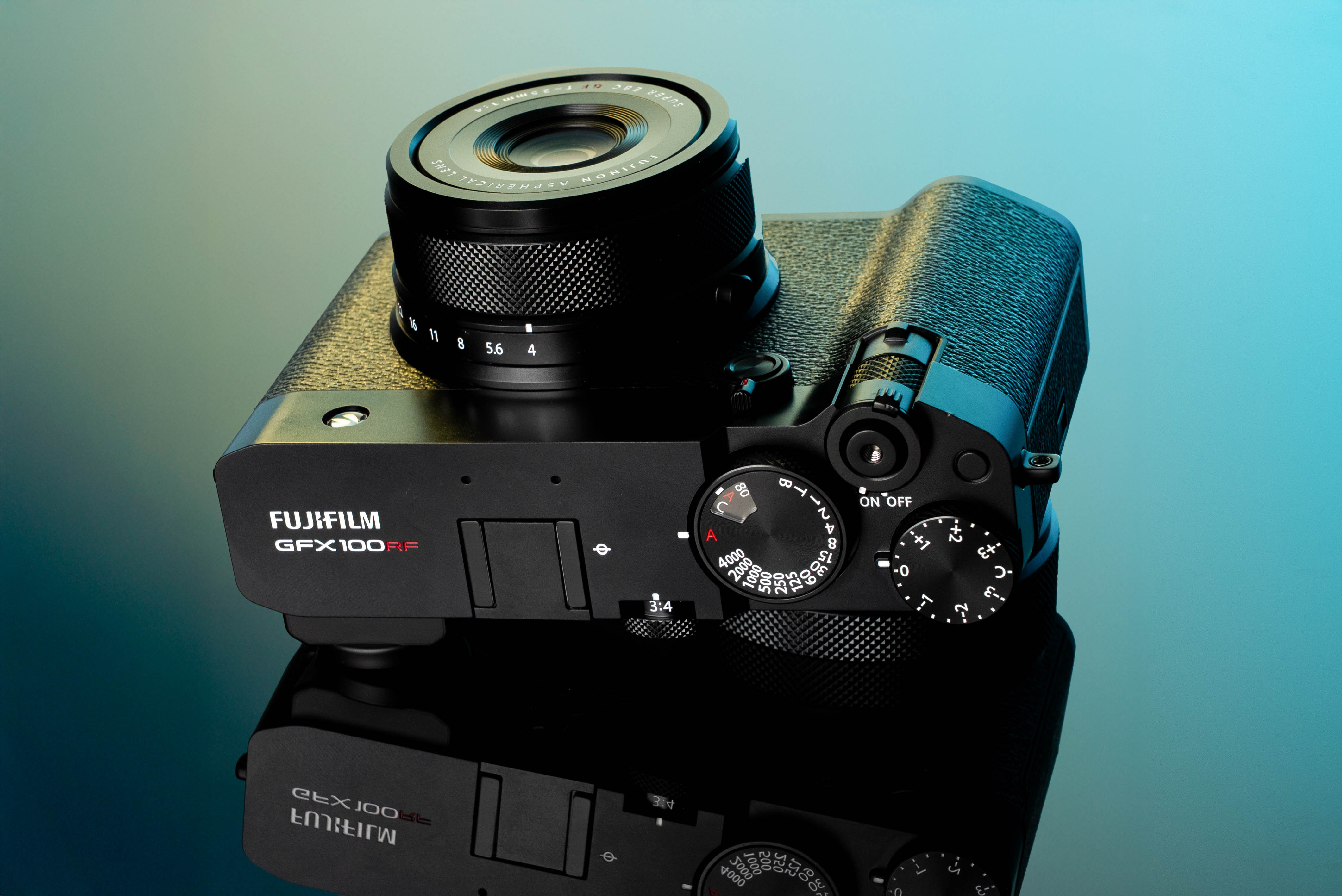 Fujifilm GFX100RF on a light blue and green background