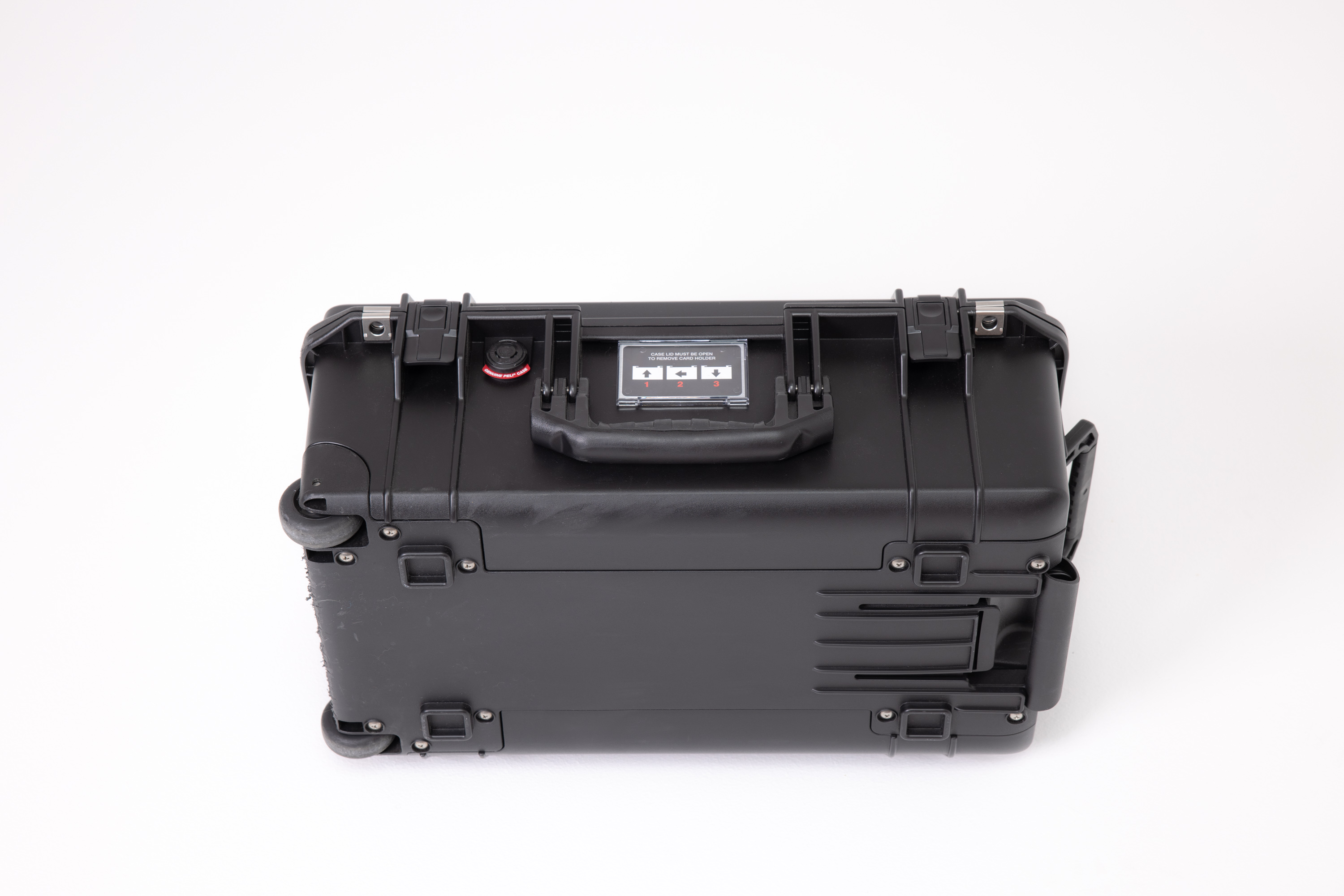 The back of the Peli 1535 Air Case photography case, showing the wheels and handles, shot against a white background