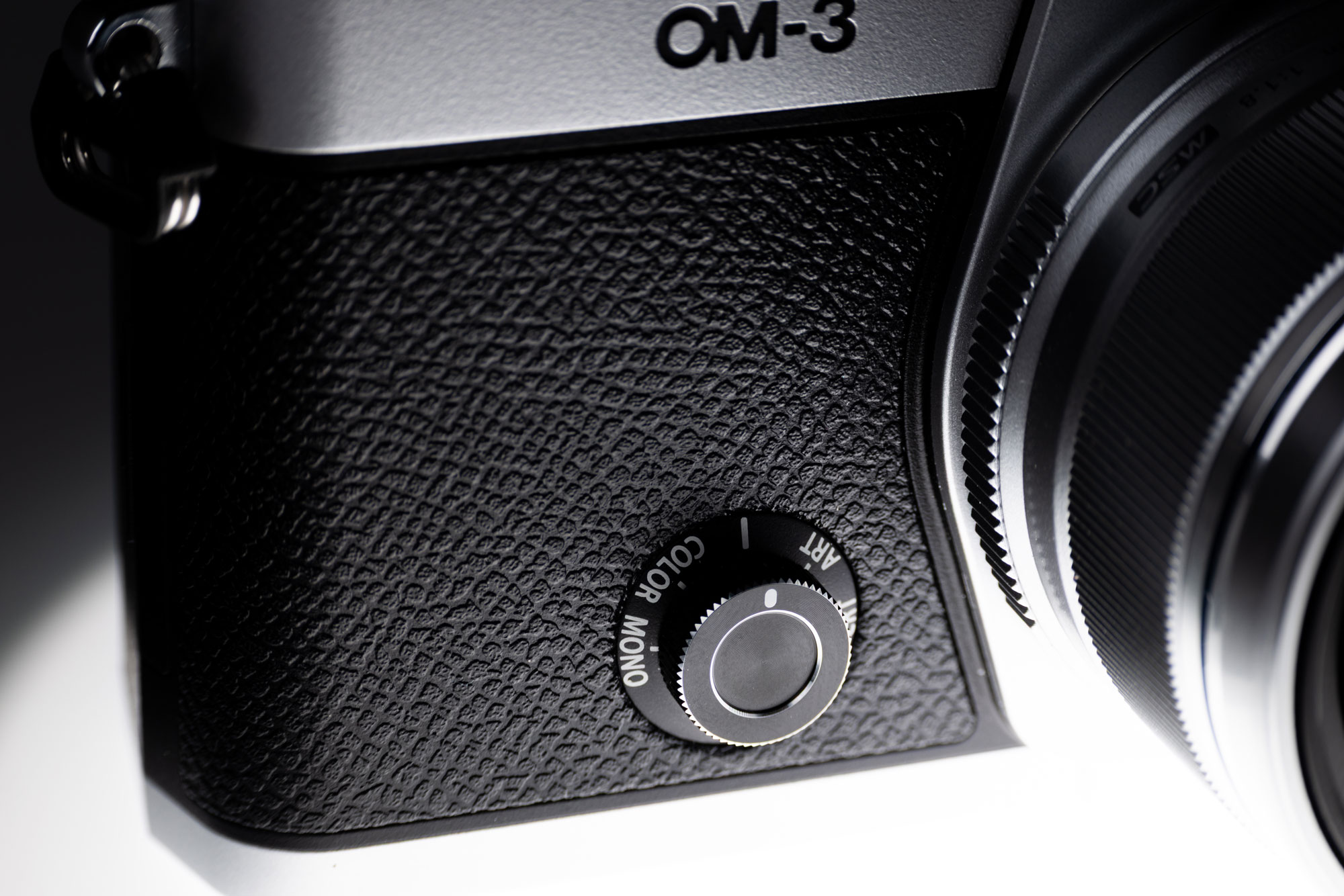 The creative dial on the front of the OM System OM-3
