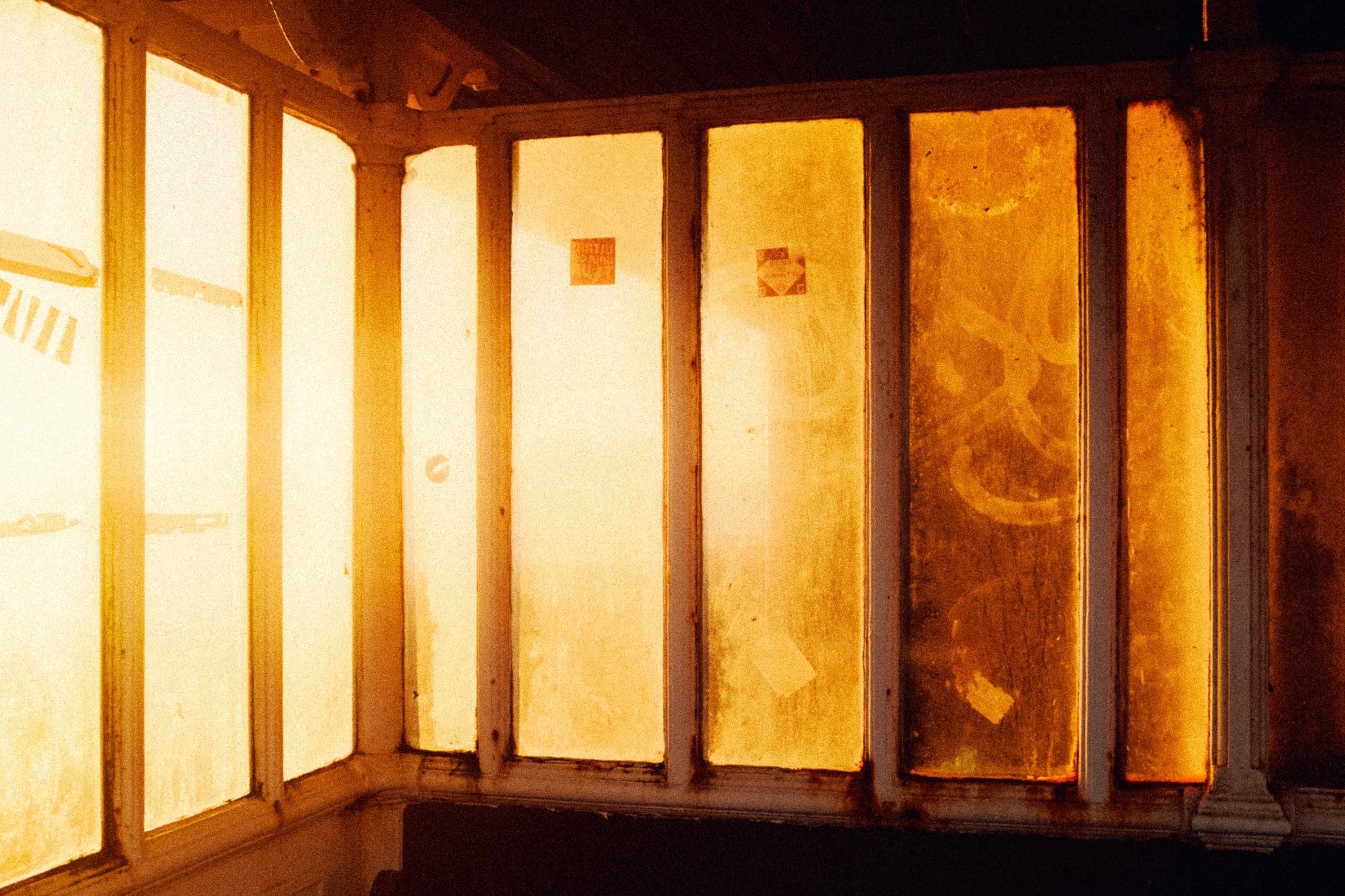 A warm light shines through window panes, creating a glowy effect. Taken by Connor Redmond on the Fujifilm X100F.
