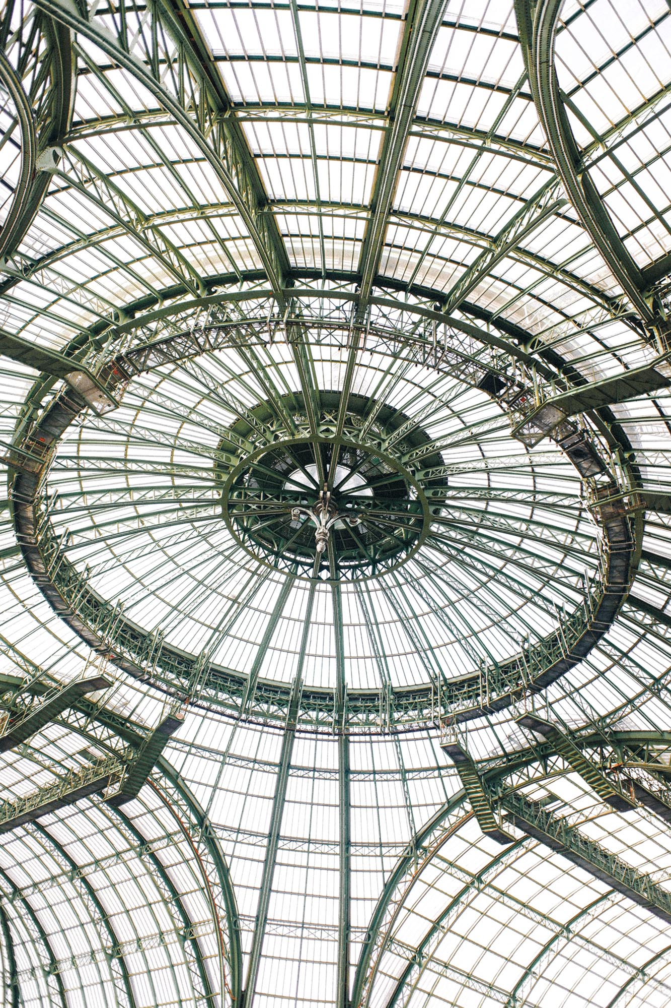 A detailed view of the Grand Palais’ iconic iron-and-glass dome, showcasing its sweeping Beaux-Arts structure and striking geometric patterns. Shot by Wesley Verhoeve on a Fujifilm XF10.