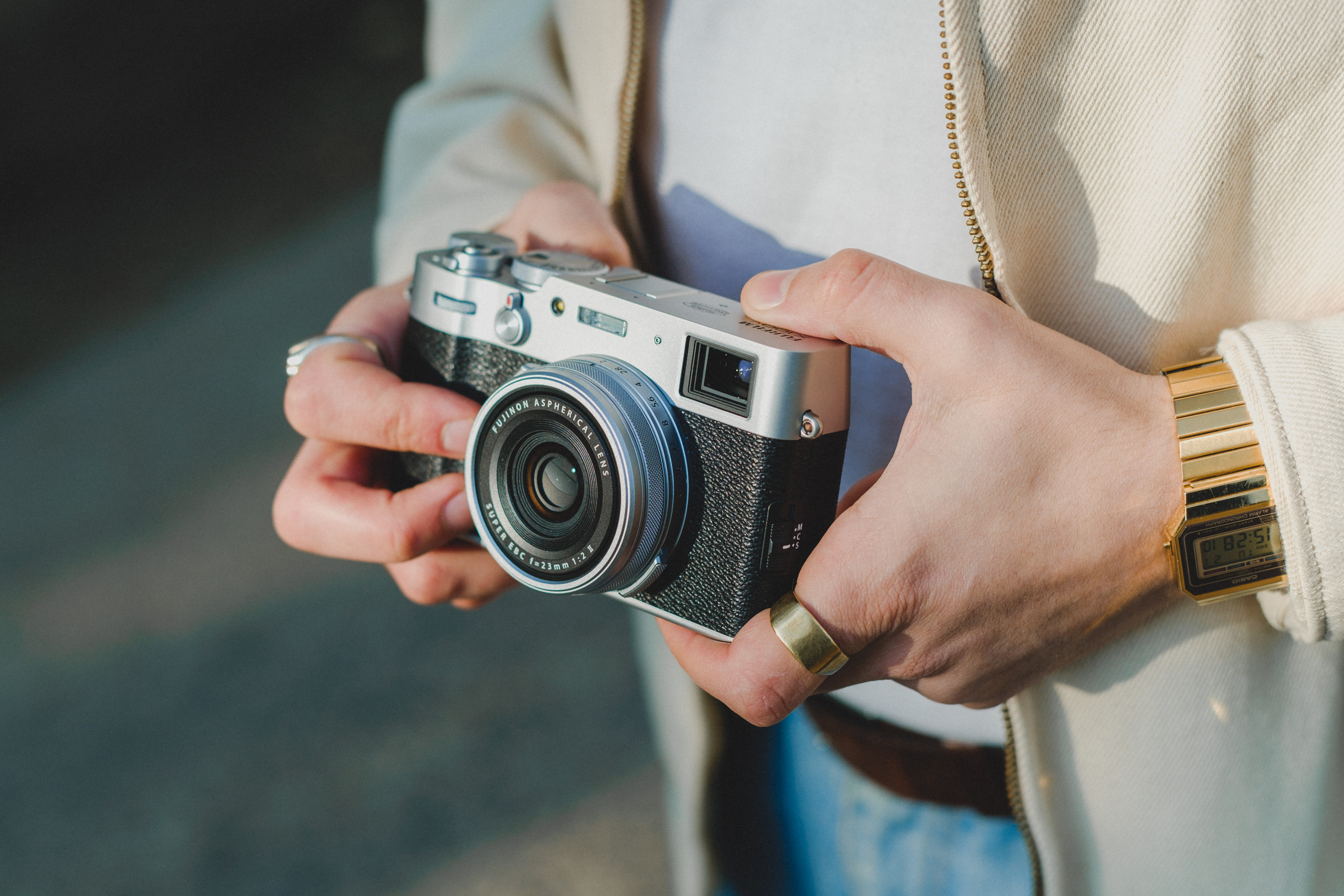 Close-up of a photographer holding a camera