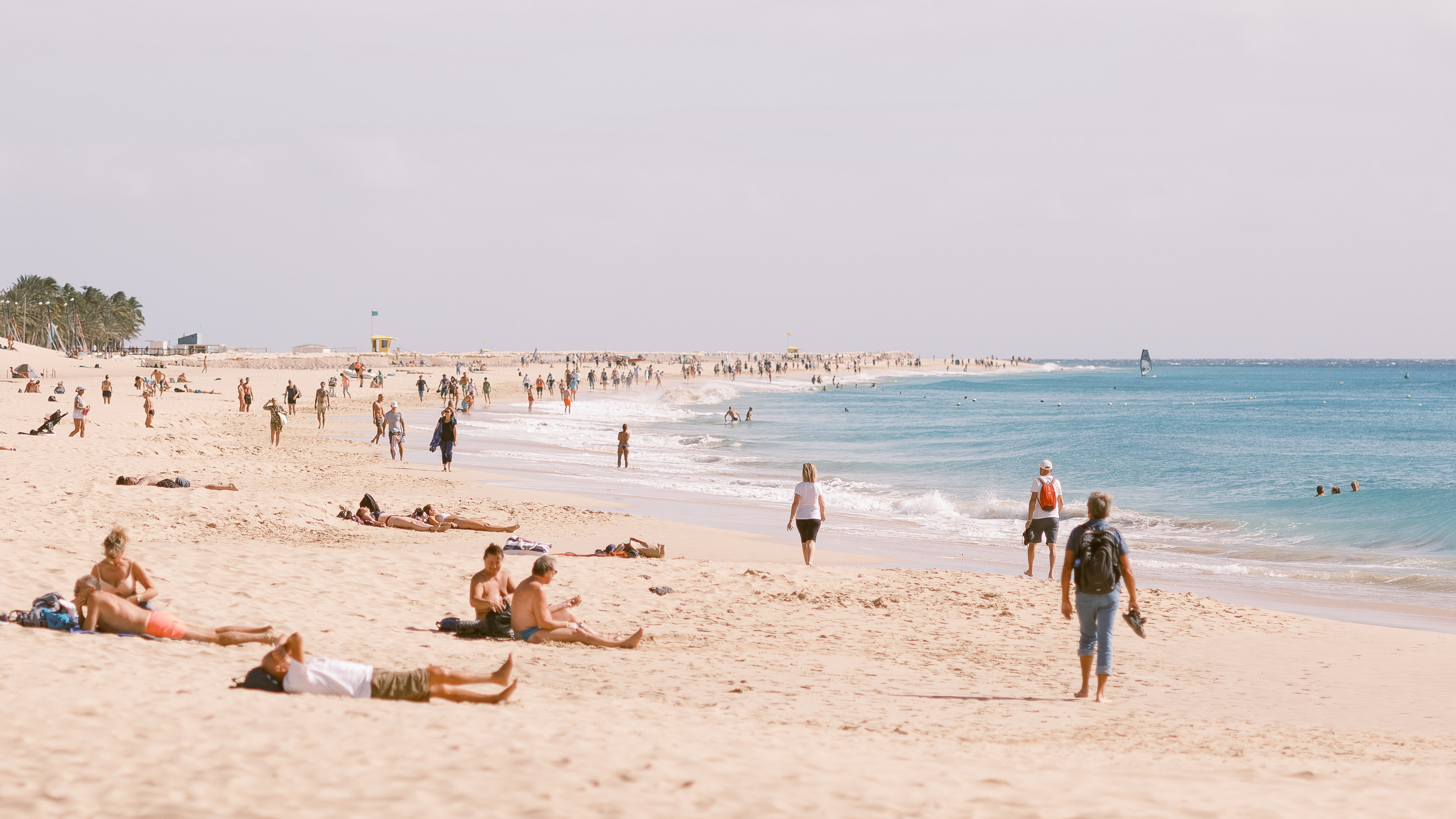 
A cropped in shot of a long sandy beach with a lot of people on it. Taken on the Fujifilm GFX 50R by Connor Redmond. 

