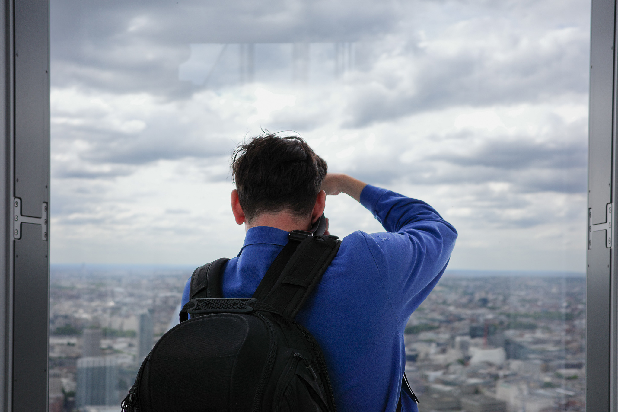 Person with cameras at the top of The Shard