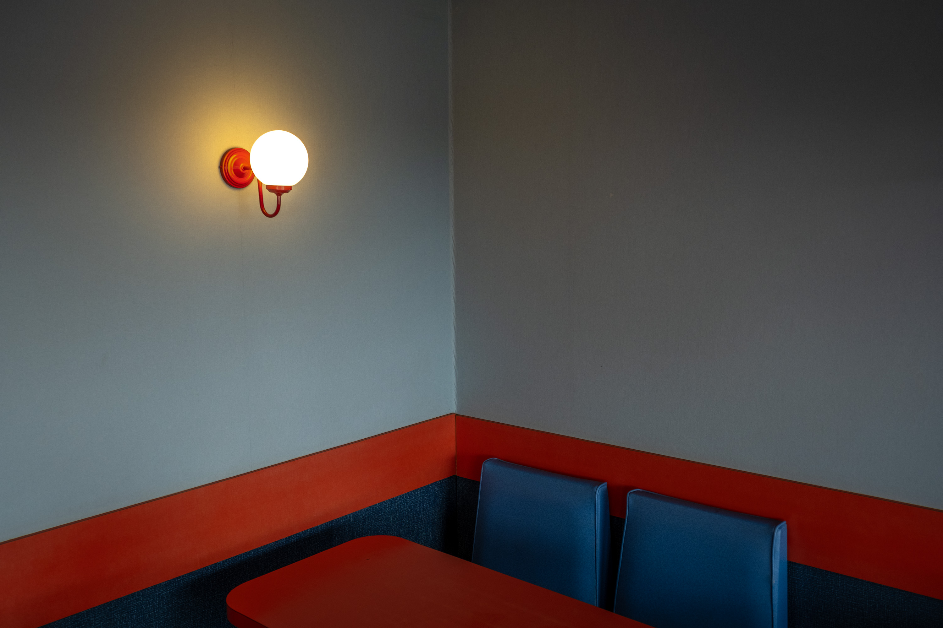 A very symmetrical red and blue cafe corner. Taken on the Fujifilm X-T4 by Ian Howorth.