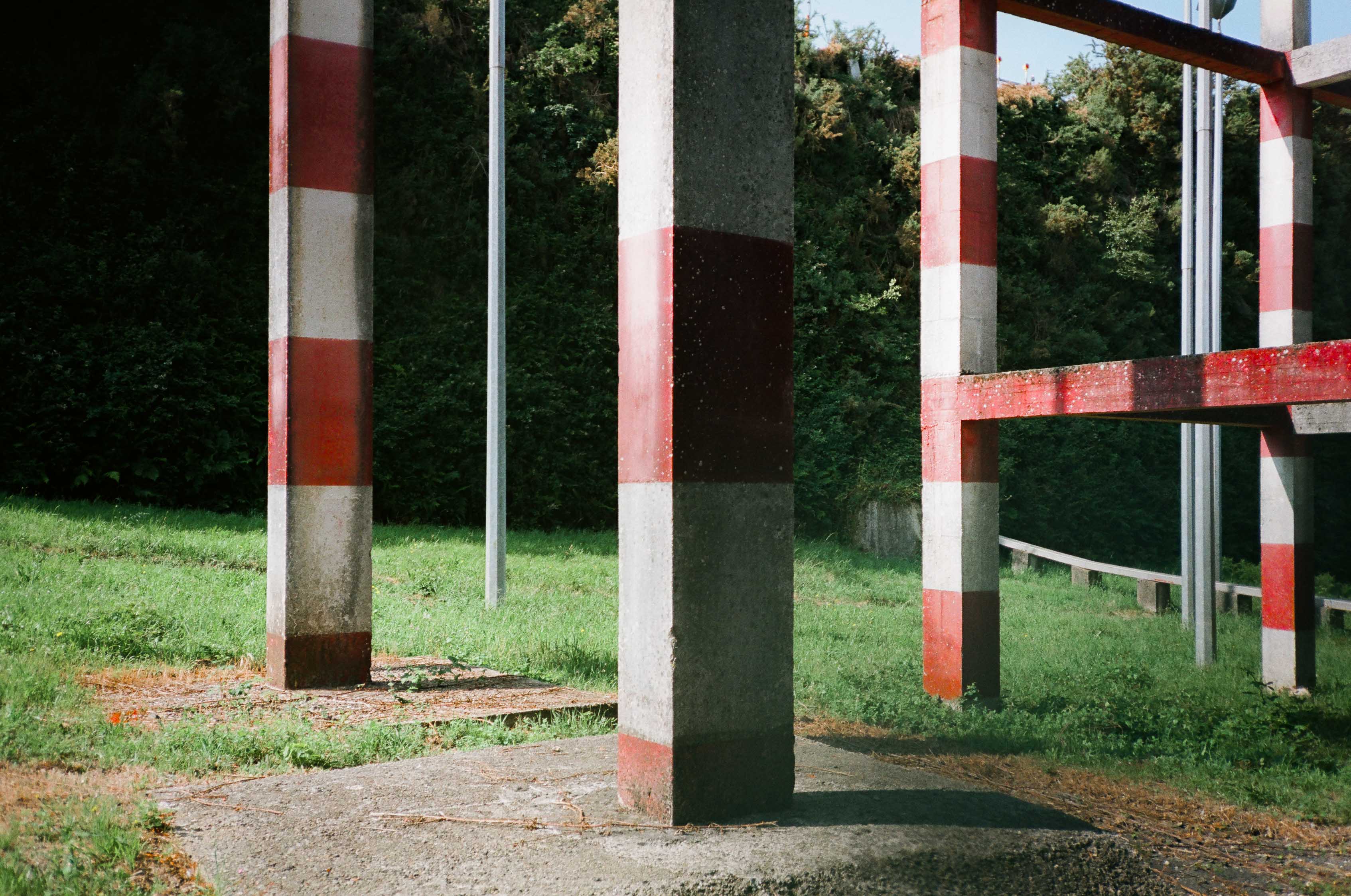 A collection of red and white pillars at the Santiago airport. By Connor Redmond.