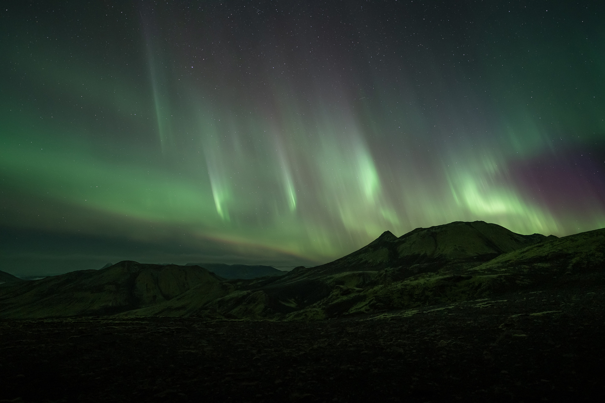 The northern lights shining over a mountain in Iceland, shot by Paul Watson with a Nikon Z6