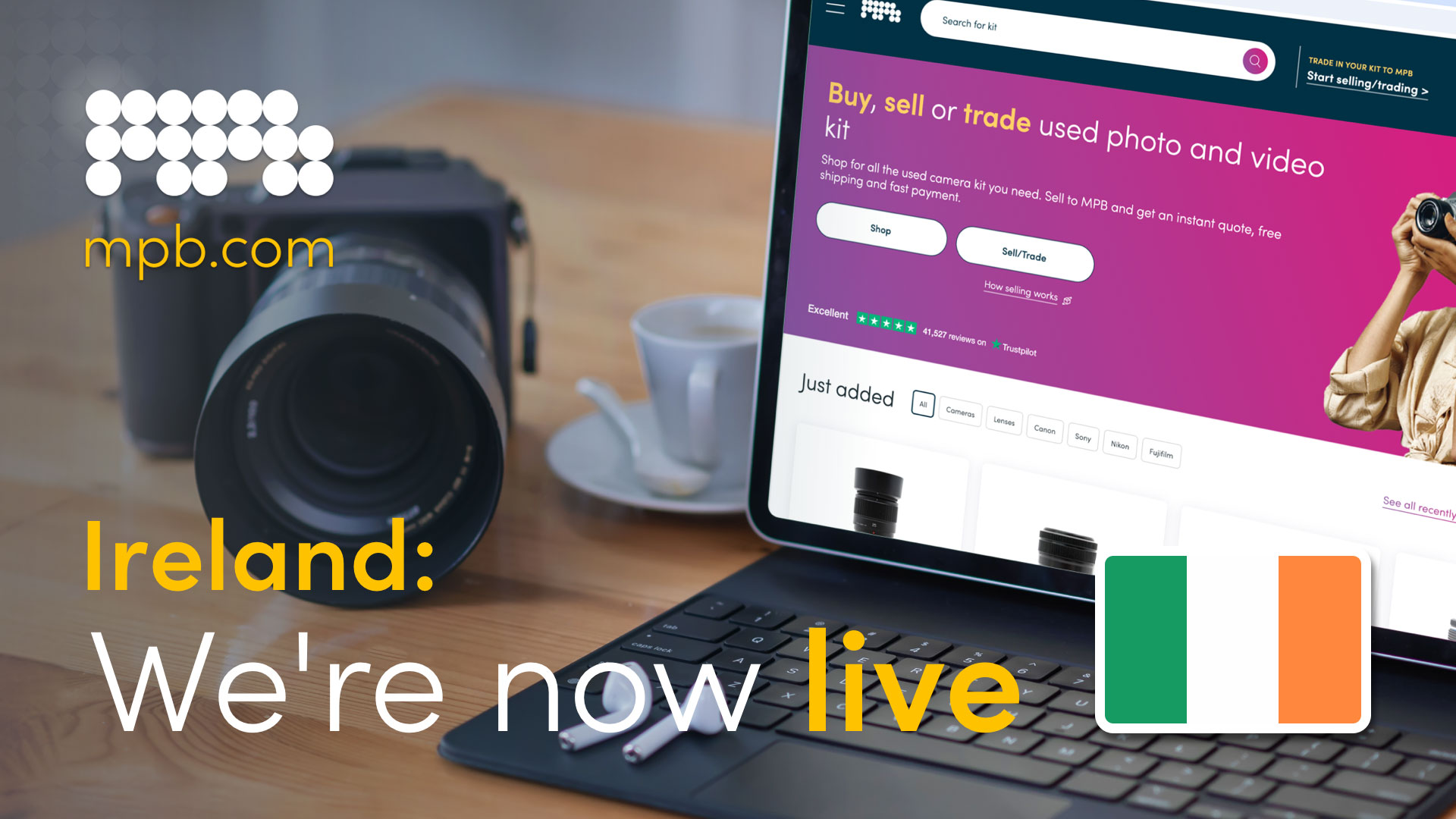 A laptop and camera on a table with text "Ireland: We're now live" overlaid