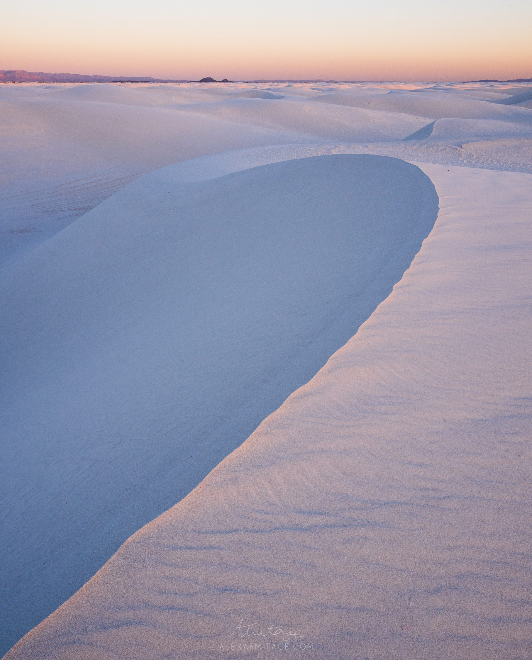 Sloping sand dune at sunset in New Mexico’s White Sands National Park in the United States, taken by Alex Armitage on a Nikon Z8.