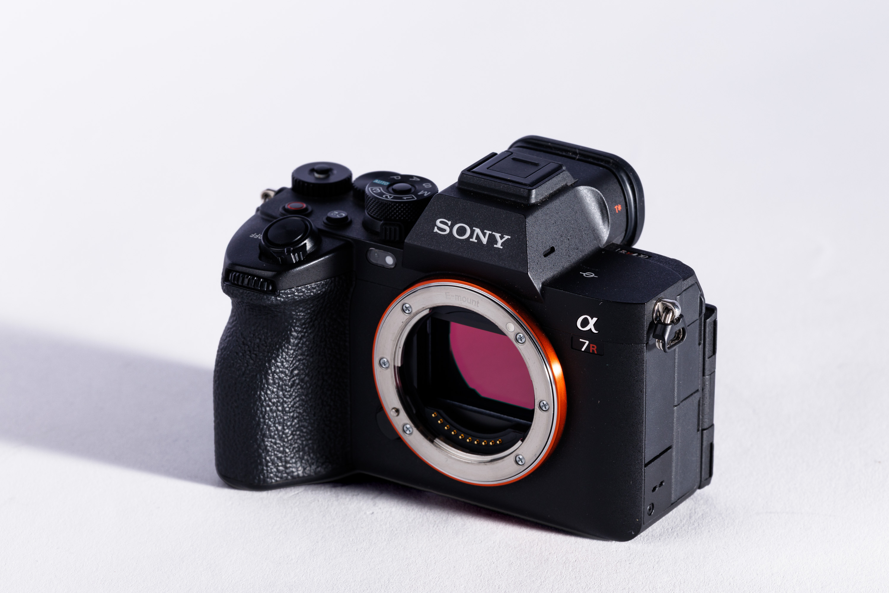 A used Sony A7R V on a white background, with a shadow to the left.