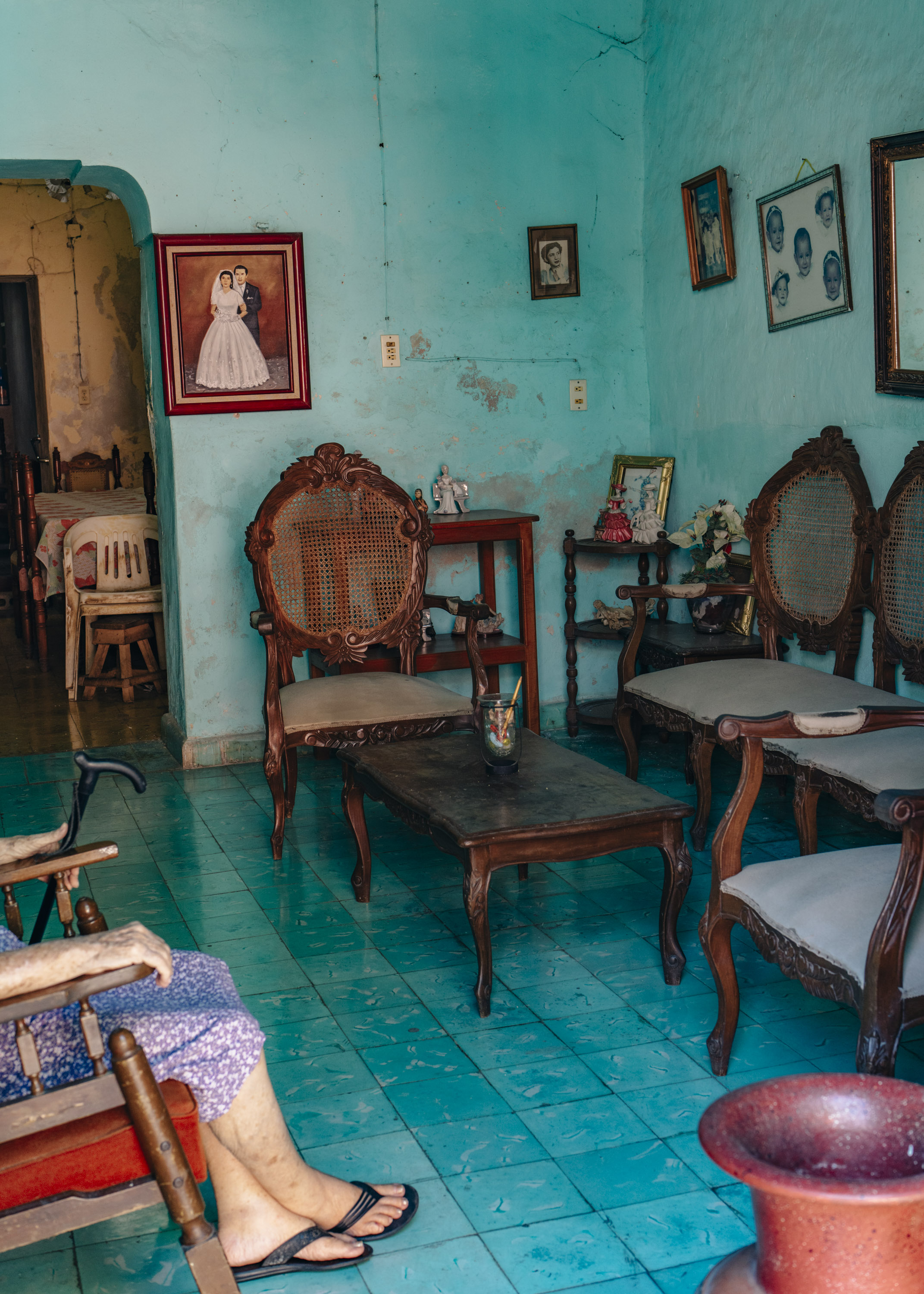 A bright Aqua-marine room with old furniture and old paintings in it. By Ian Howorth.