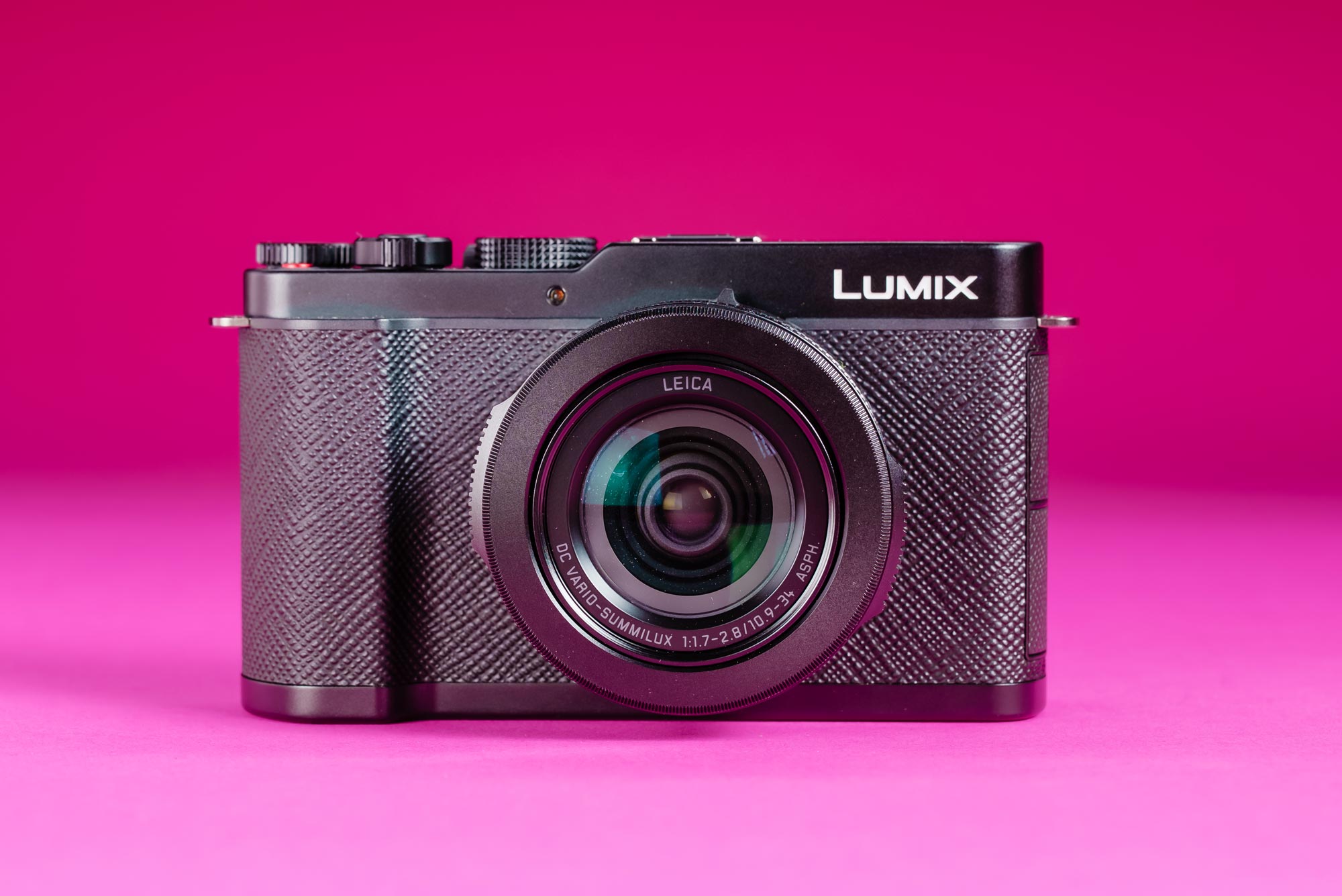 A used Panasonic Lumix L10 on a pink background.