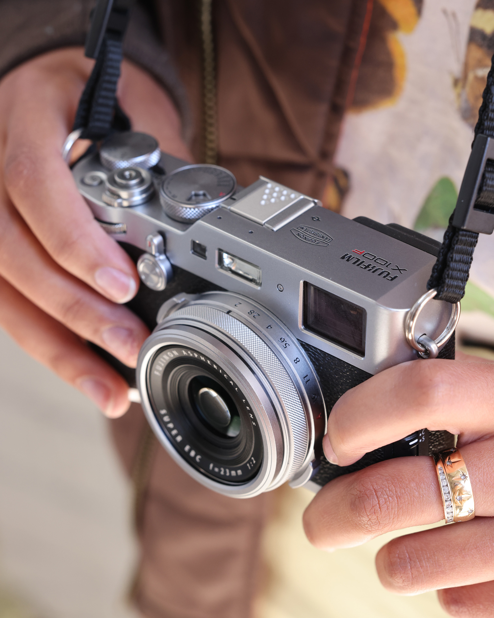 Fujifilm X100F in the hands of a photographer
