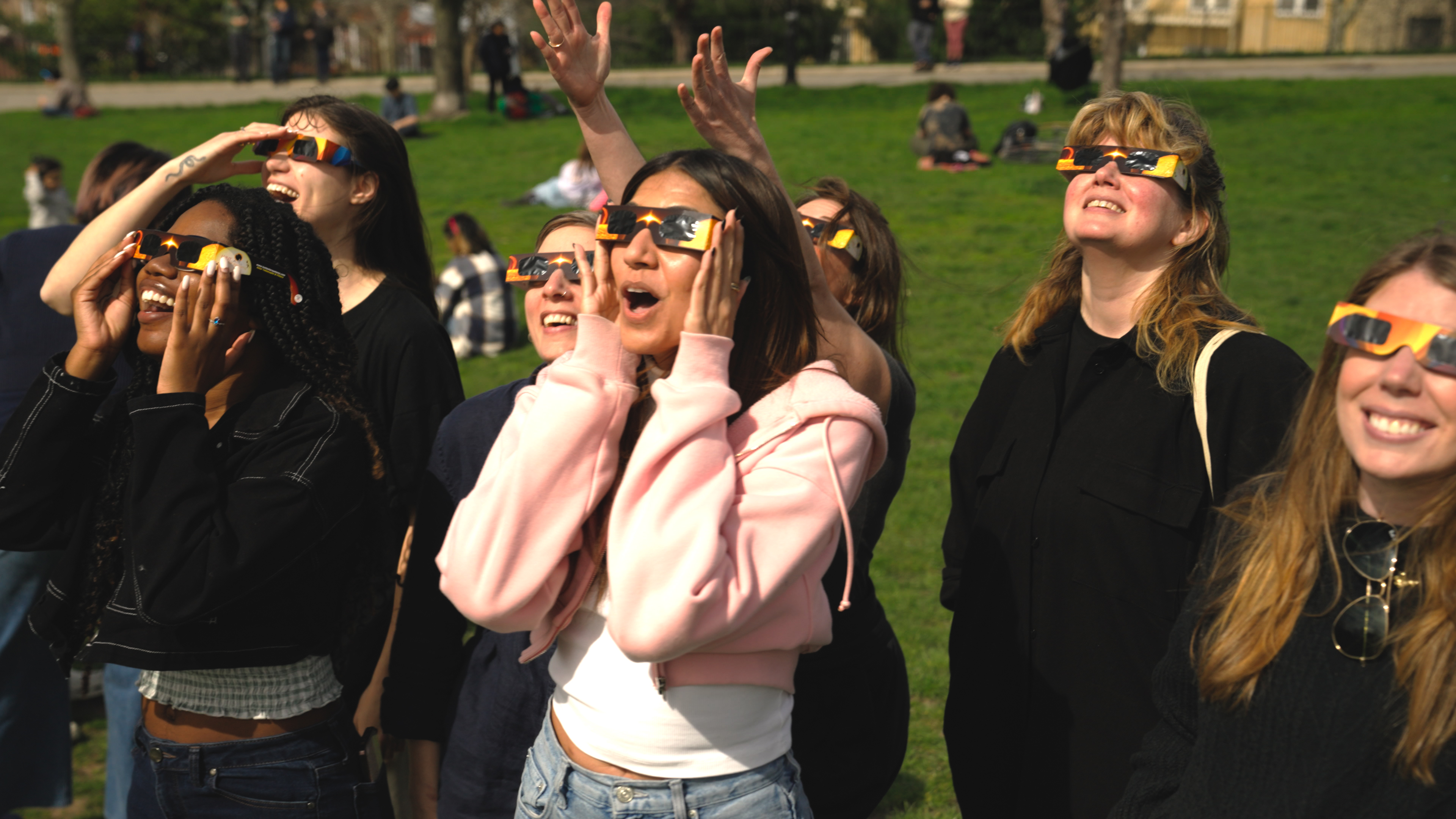 Crowd in awe observing the eclipse in New York