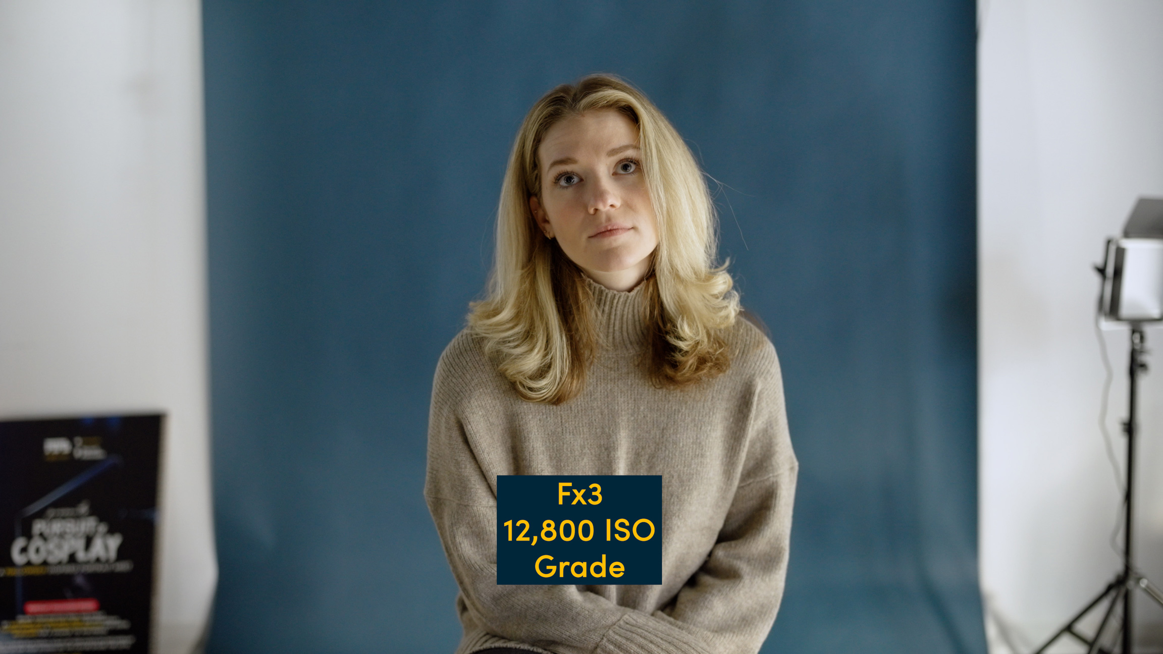 Photo from a Sony Fx3 using high ISO values in a photo studio with blue backdrop