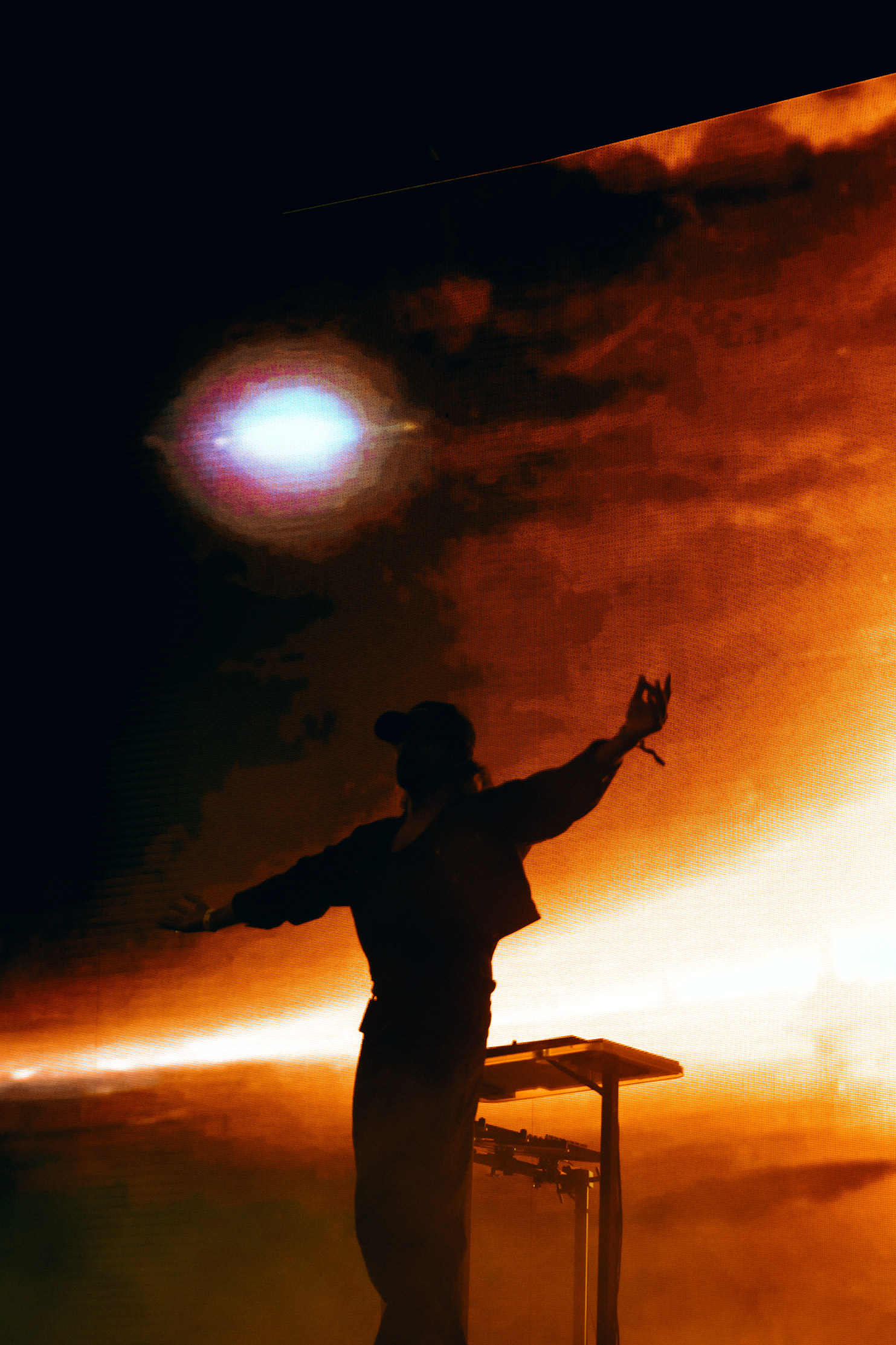 Photo of Jai Wolf in front of an LED background on-stage during their performance at Coachella Music Festival 2023.