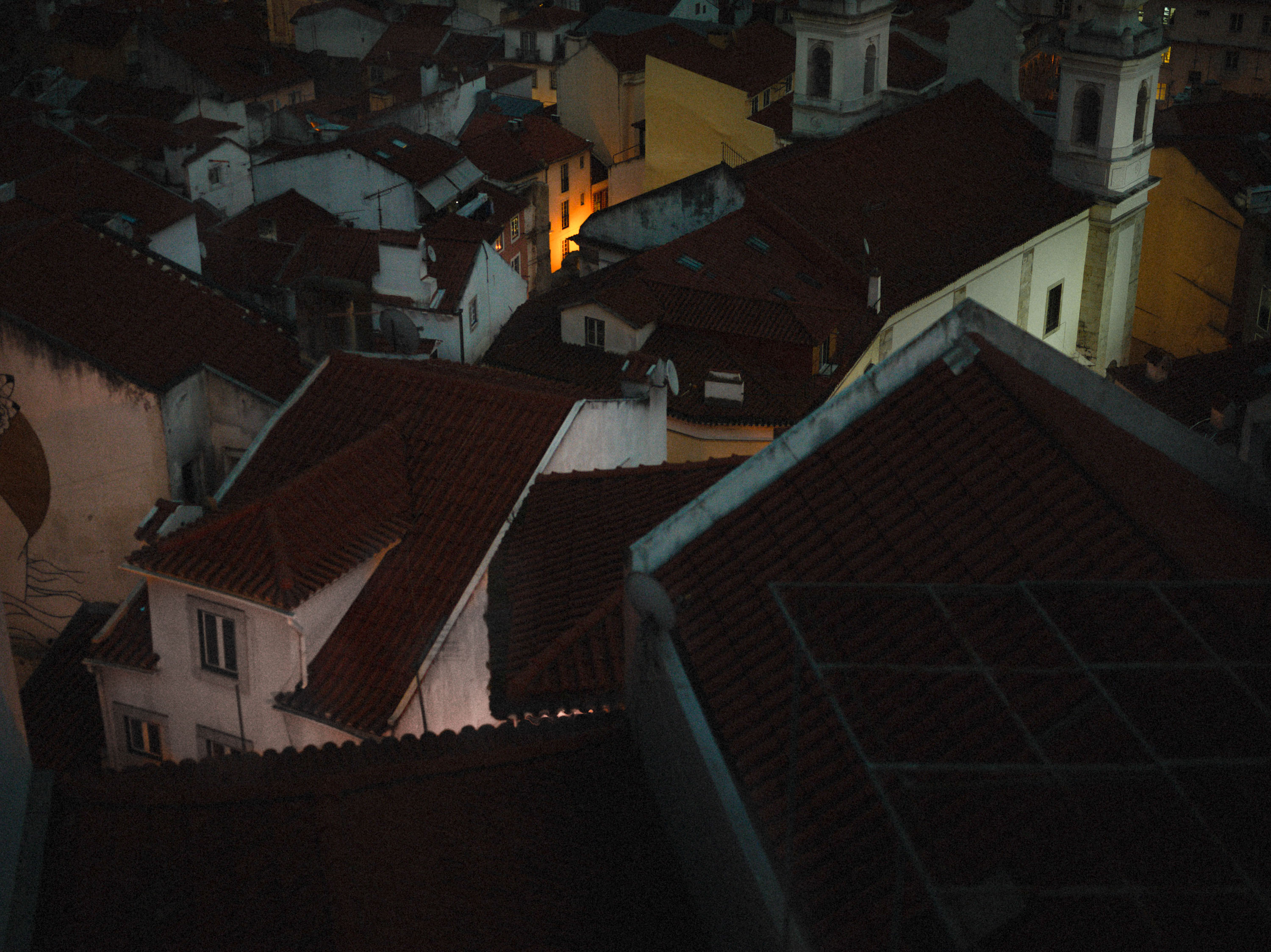 A photo of roofs of buildings with a single light source, shot on Phase One P45 Plus by Ian Howorth