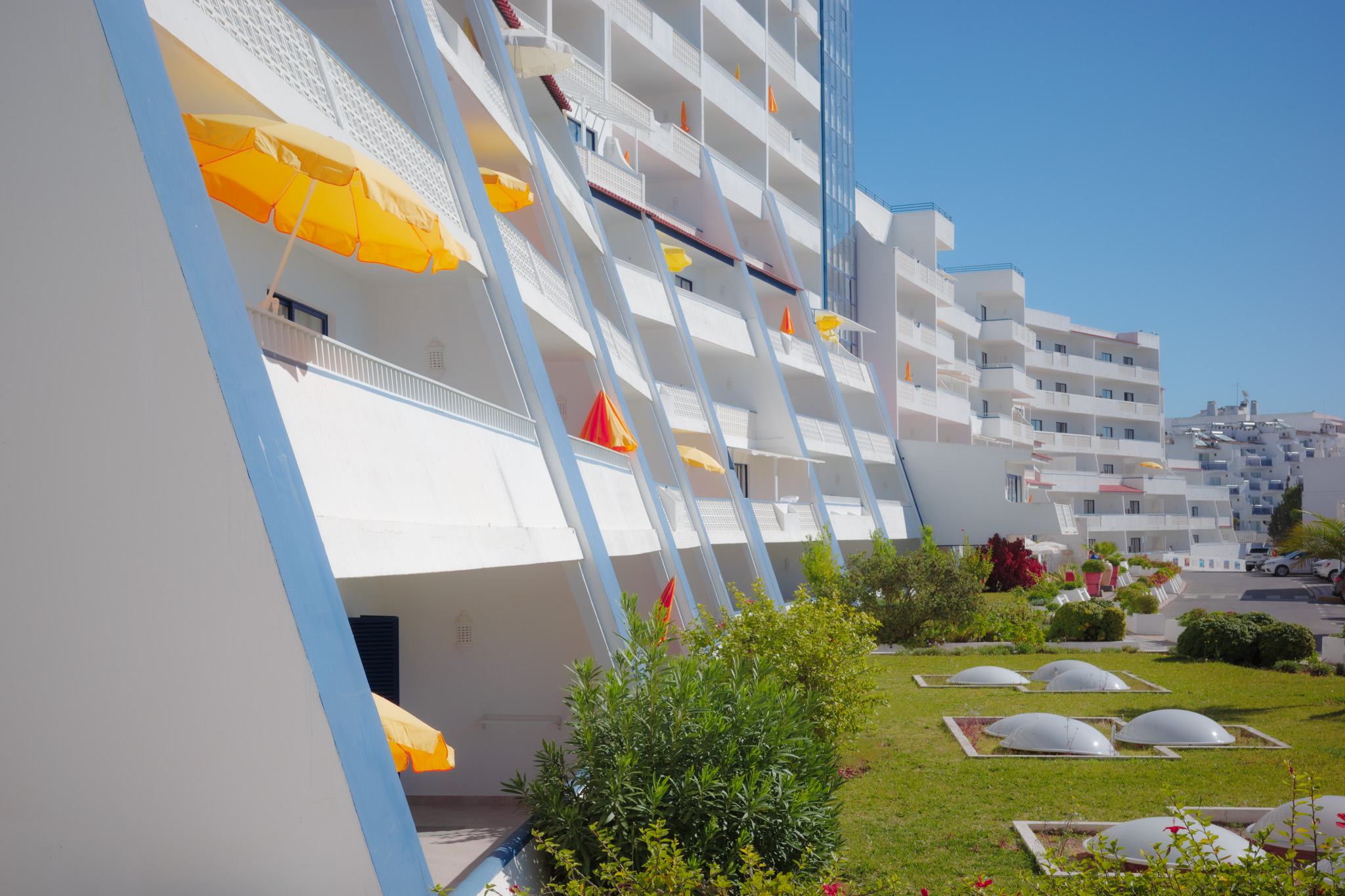 A bright and colourful Spanish holiday resort. By Connor Redmond.