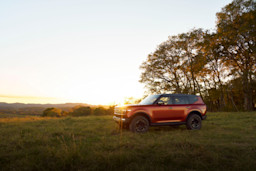 Side view of a traveler with sunlight casting shadows