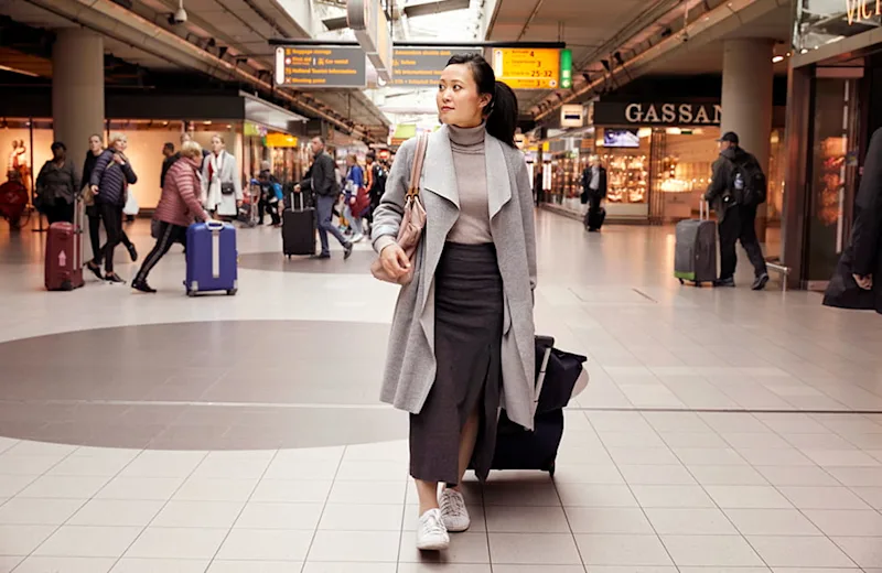 Traveller at Plaza with suitcase