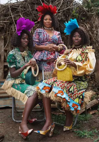 3 women from the City of Joy in outfits made from Vlisco fabric
