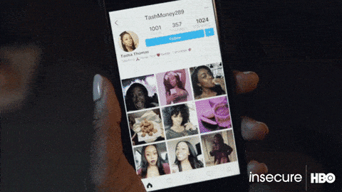 looking at intagram on phone (from 'hbo Insecure)