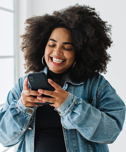 Happy woman using phone