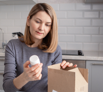 Woman with drugs from post box mobile