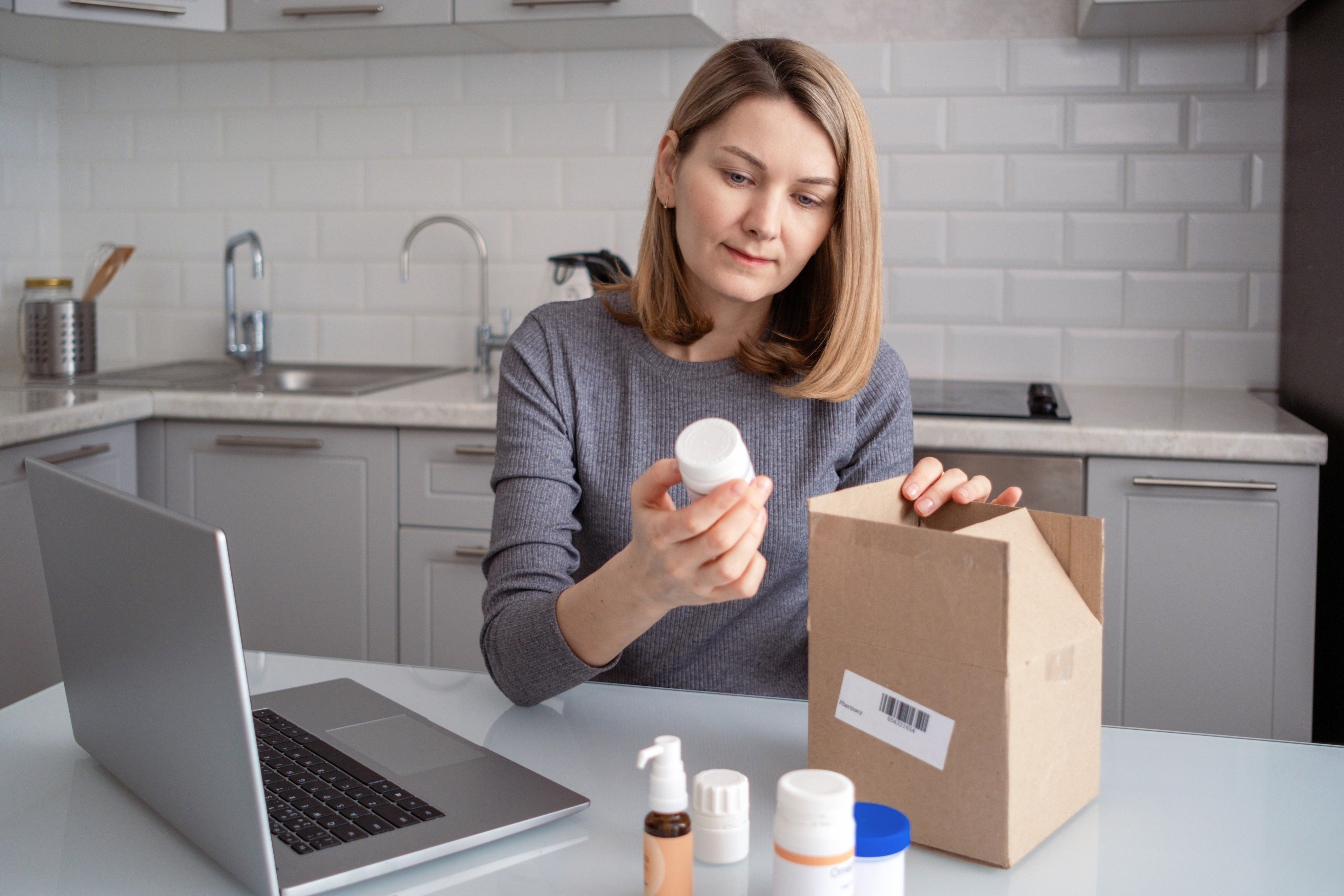 Photo of women that put out pills from box