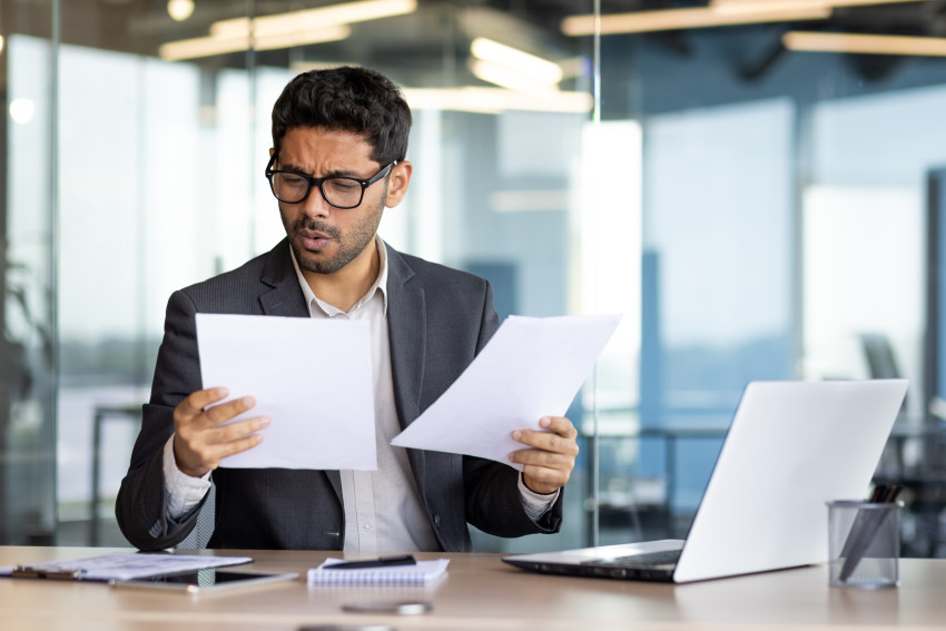 man reading contract, confused