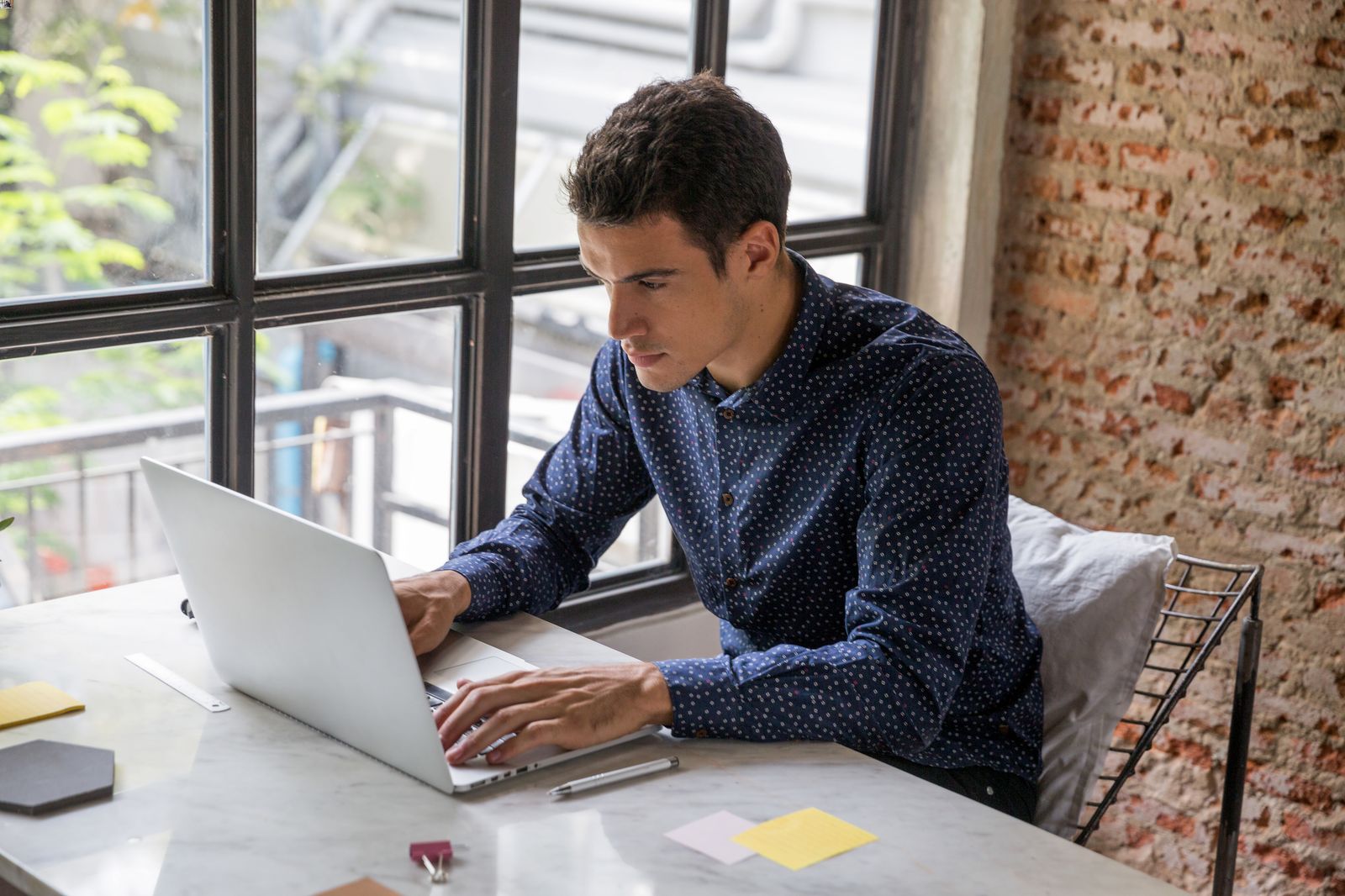 man looking at computer