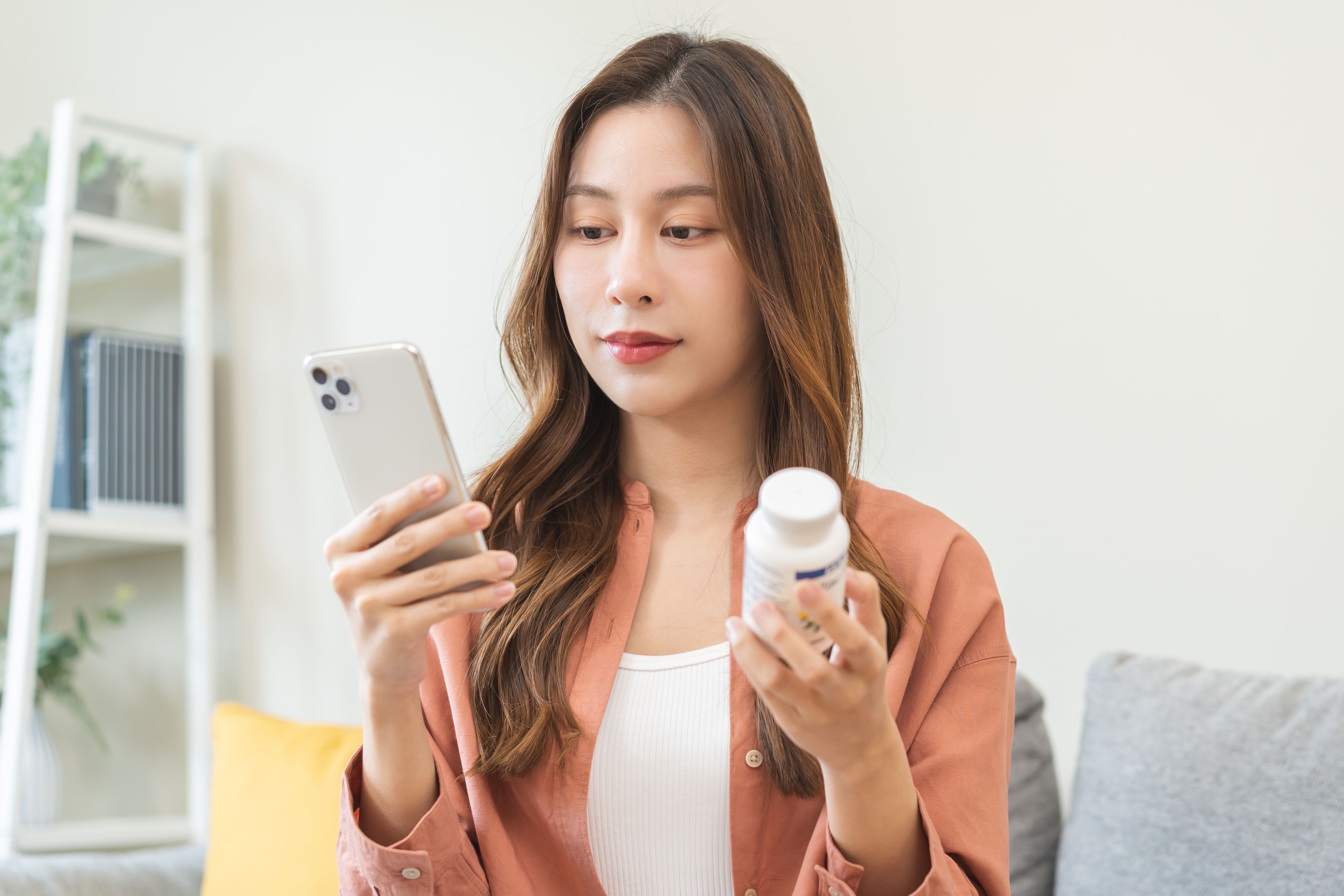 Woman with prescription receiving high-touch pharmacy navigation