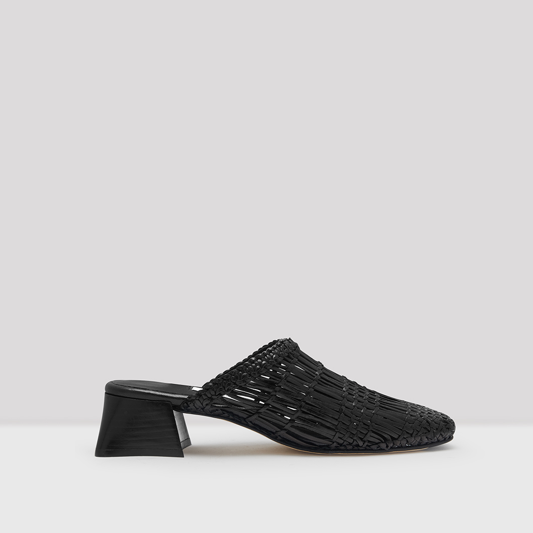 black woven leather mules