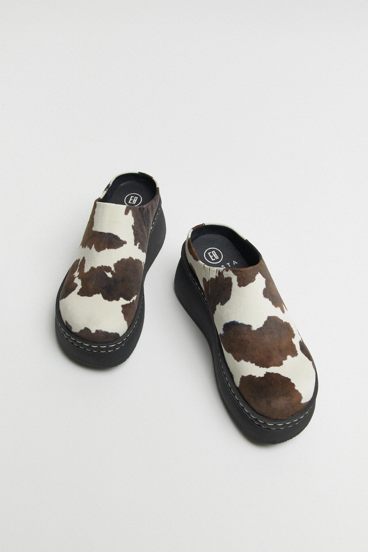 E8-kristi-cow-print-mules-04