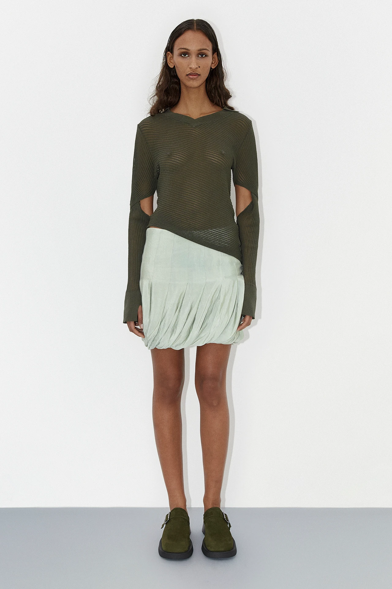 Total-thani-washed-mint-skirt-roisin-green-knit-top-aroa-khaki-suede-buckled-mules-01