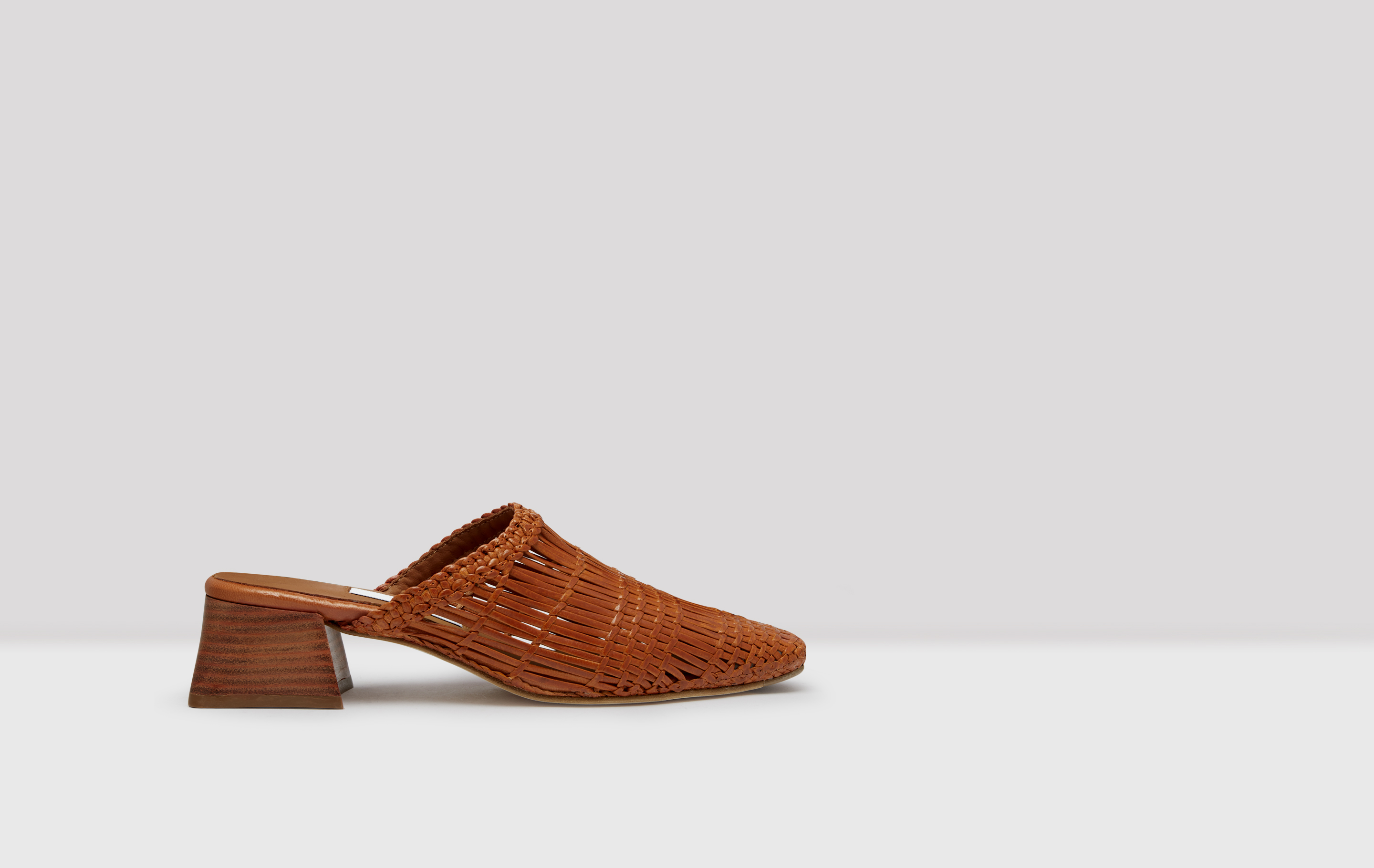 brown woven leather mules