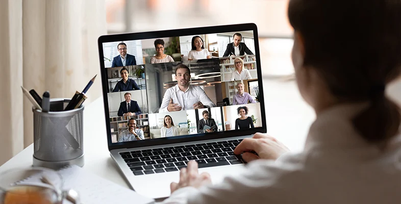 Individual attending Indigo Slate Everywhere Experiences virtual laptop meeting