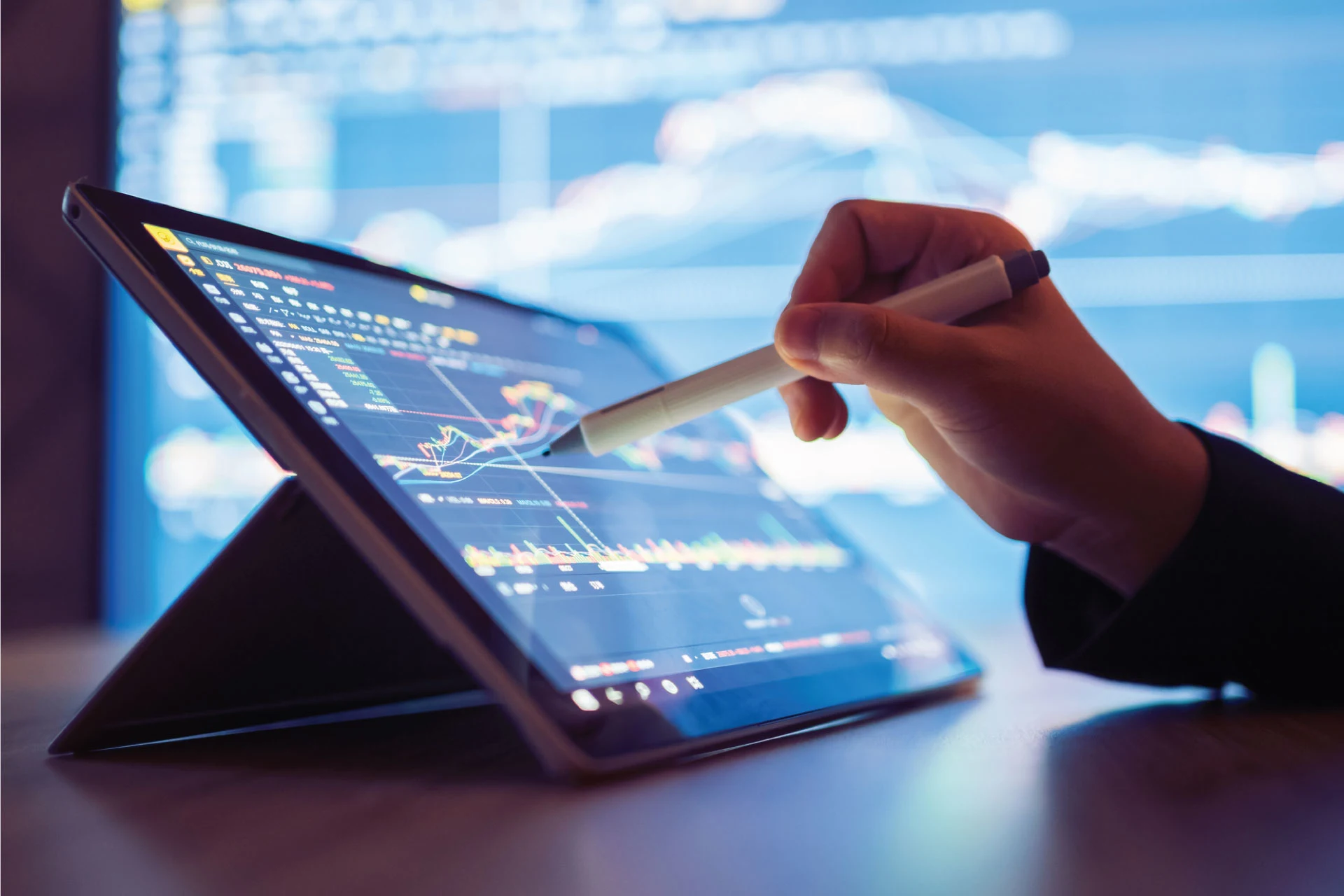 Person analyzing data on a tablet for anomaly detection improvements